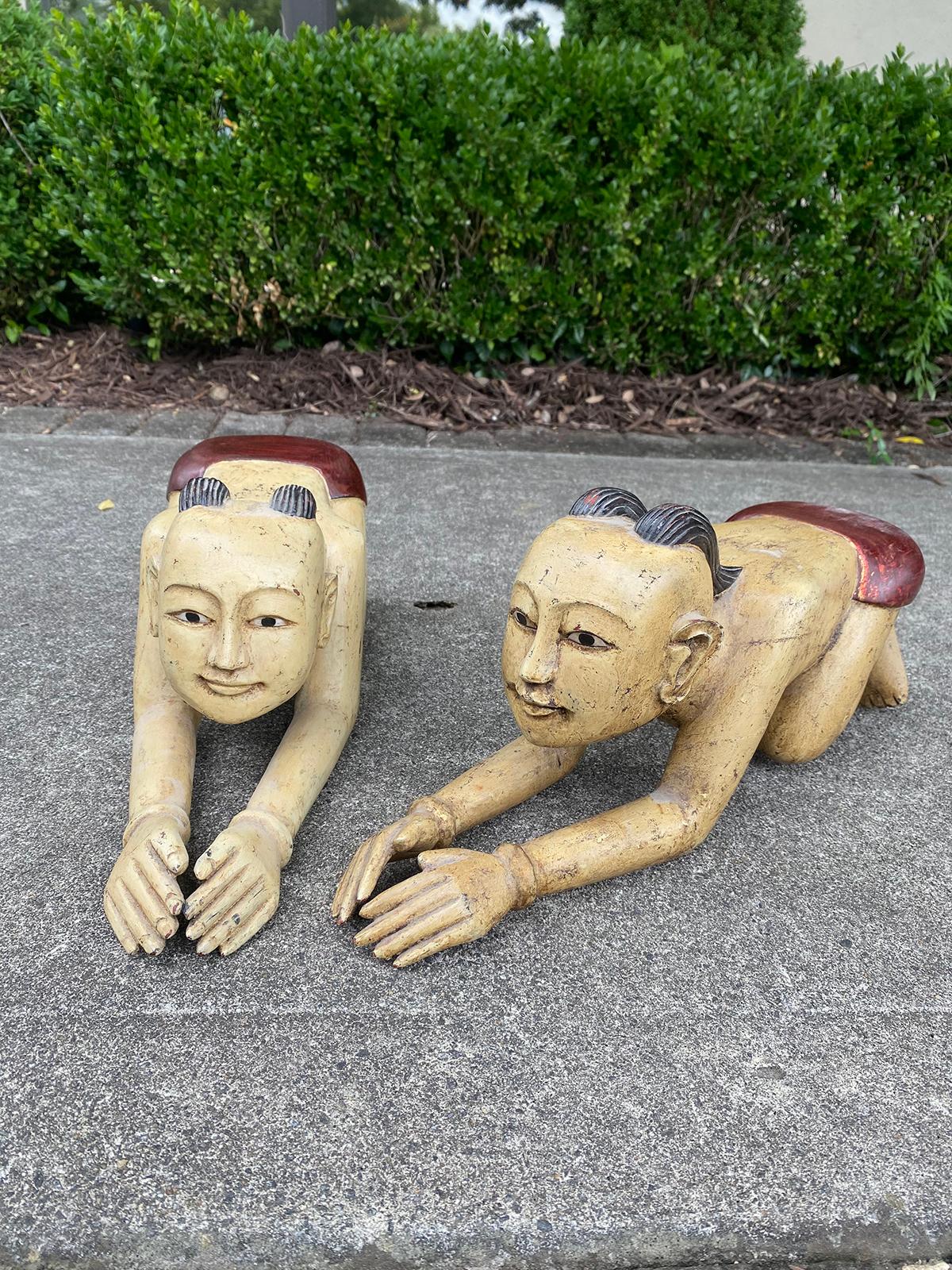 Pair of mid-20th century carved wooden Thai or Burmese kneeling figures.