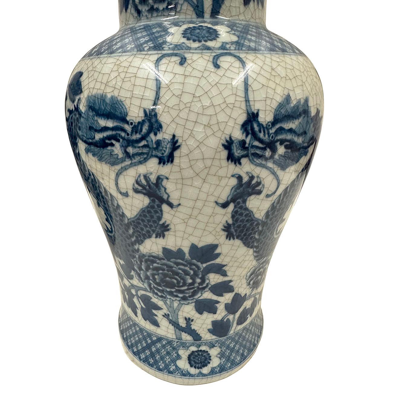 Hand-Painted Pair of Mid-20th Century Chinese Blue and White Dragon Porcelain Vases with Lid For Sale