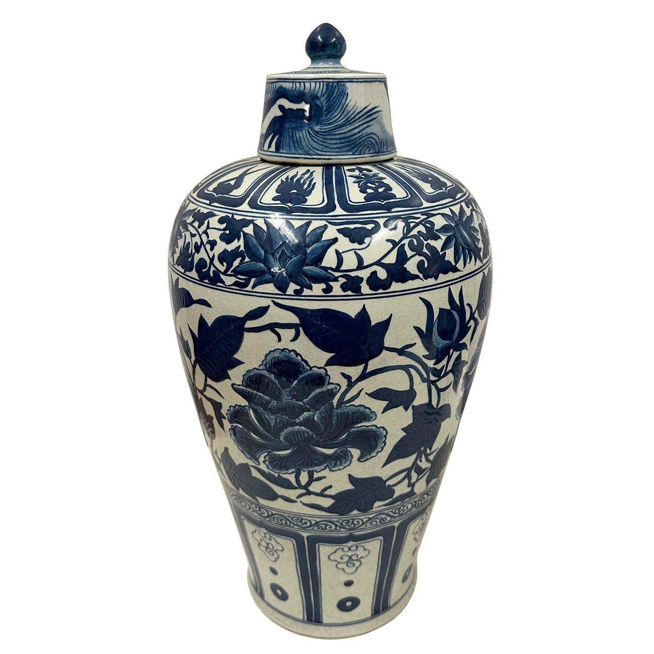 An exquisite pair of Chinese porcelain lidded vases, in Ginger Jar shape and beautifully hand-painted with a traditional decoration of Peony flower on the lid and body. This magnificent Chinese Blue and White porcelain vases were hand made and hand