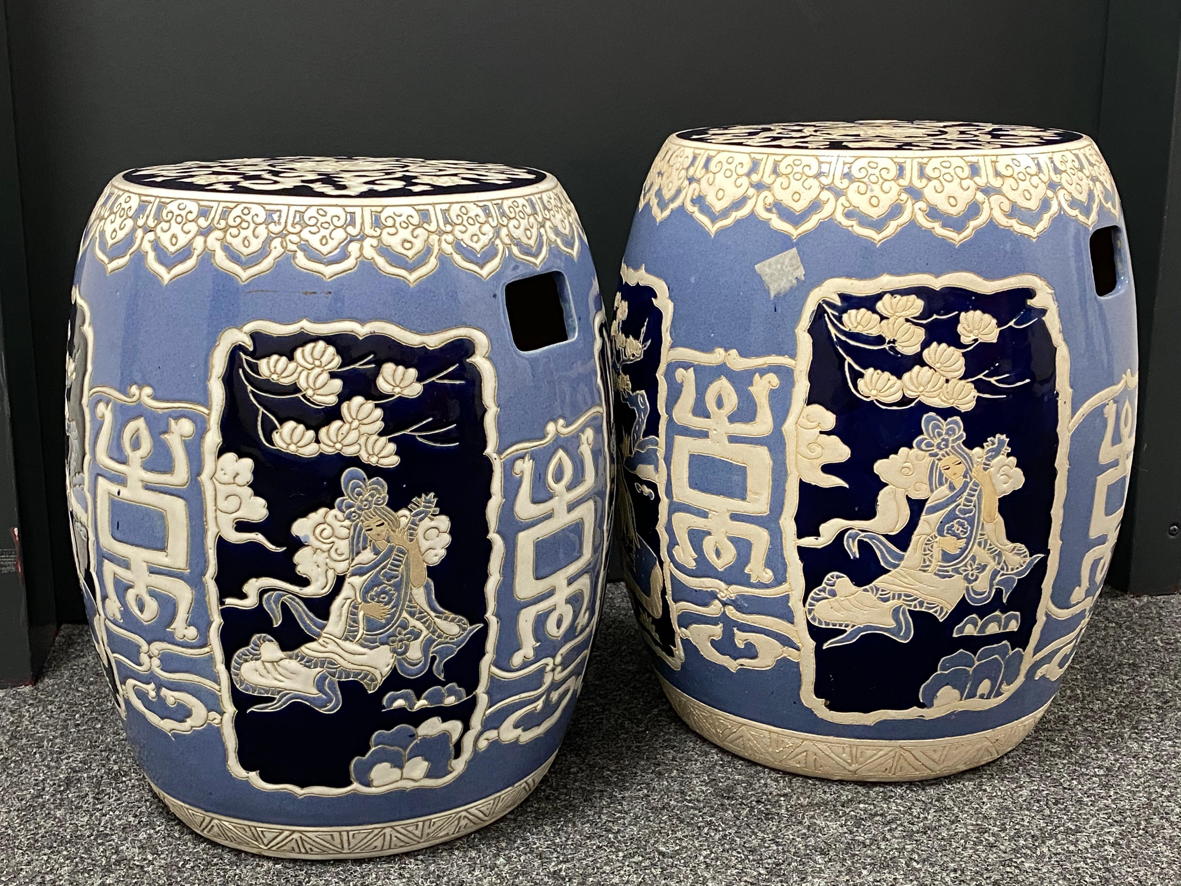 A pair of mid-20th century chinoiserie blue and white hand painted ceramic garden stool or flower pot seat. The landscape surrounding an 18th century Hampshire estate inspired this traditional outdoor ceramic garden stool. An instant demarcation of