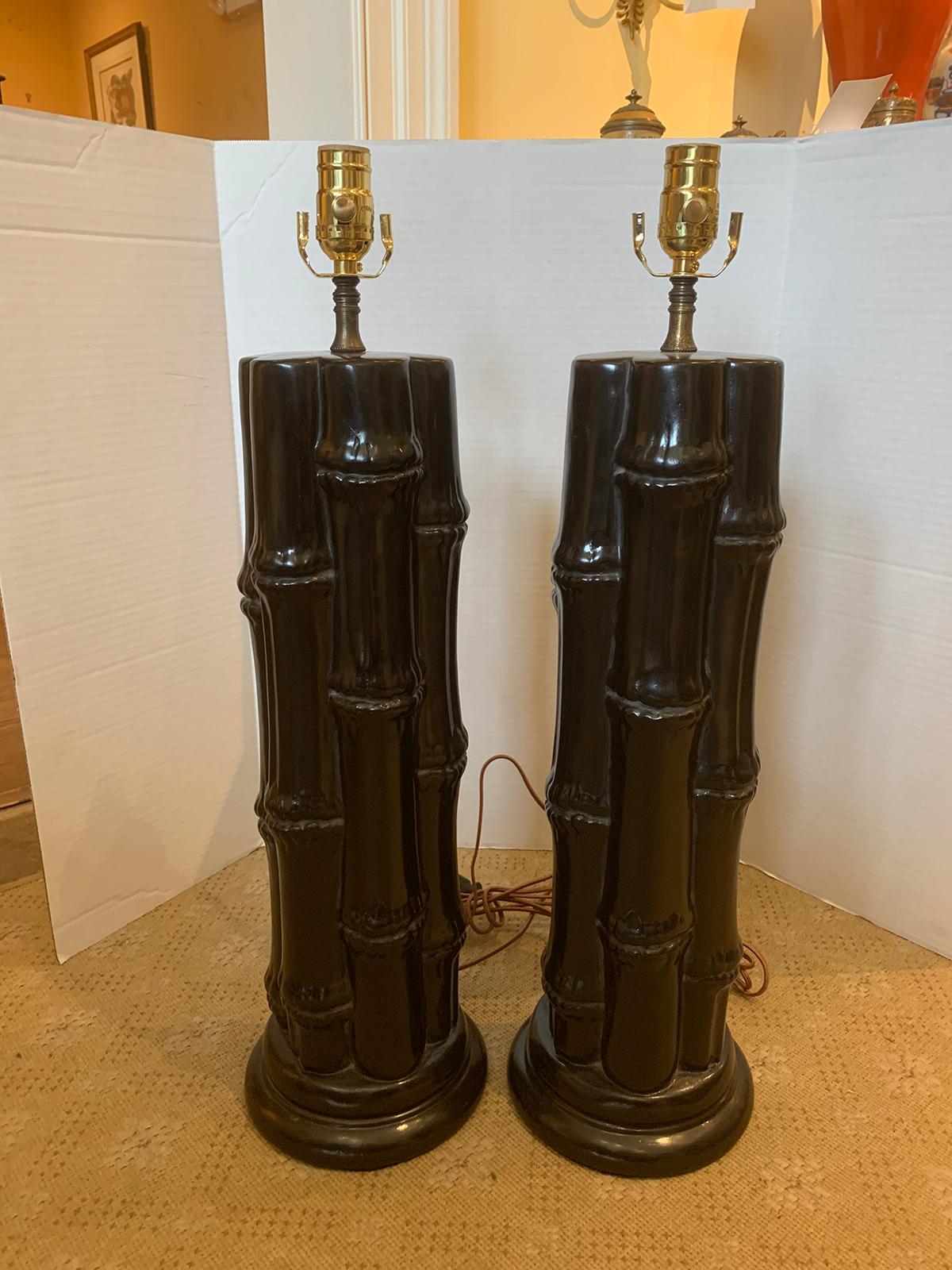 Pair of mid-20th century ebonized faux bamboo column lamps.
New wiring.