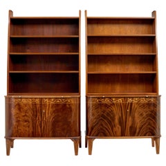 Pair of mid 20th century flame mahogany Swedish bookcases by Bodafors