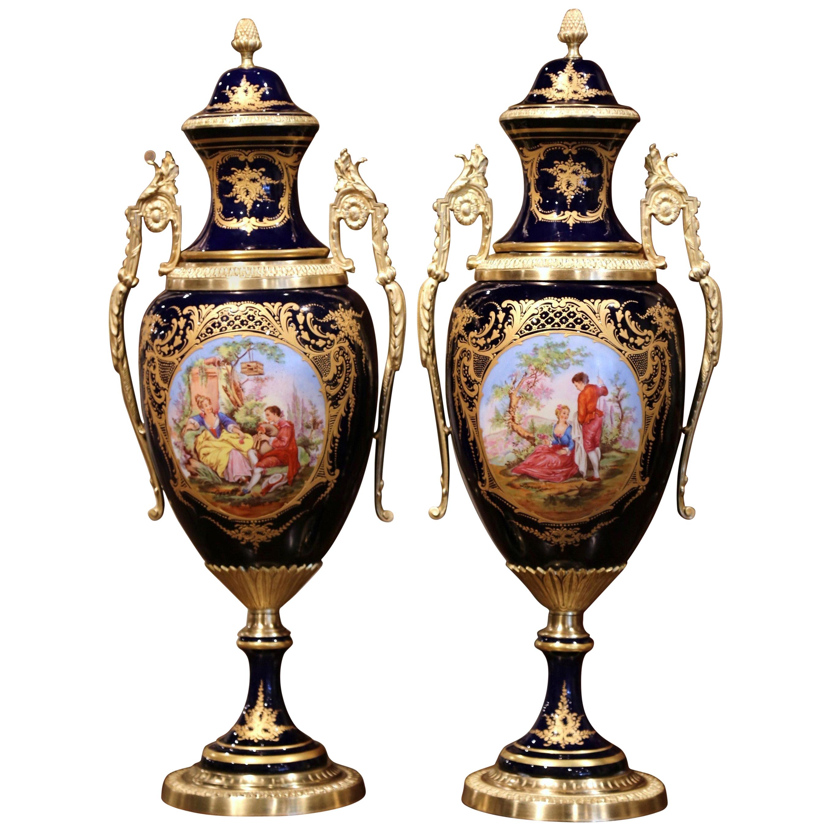 Pair of Mid-20th Century French Blue Royal Porcelain and Bronze Sèvres Urns