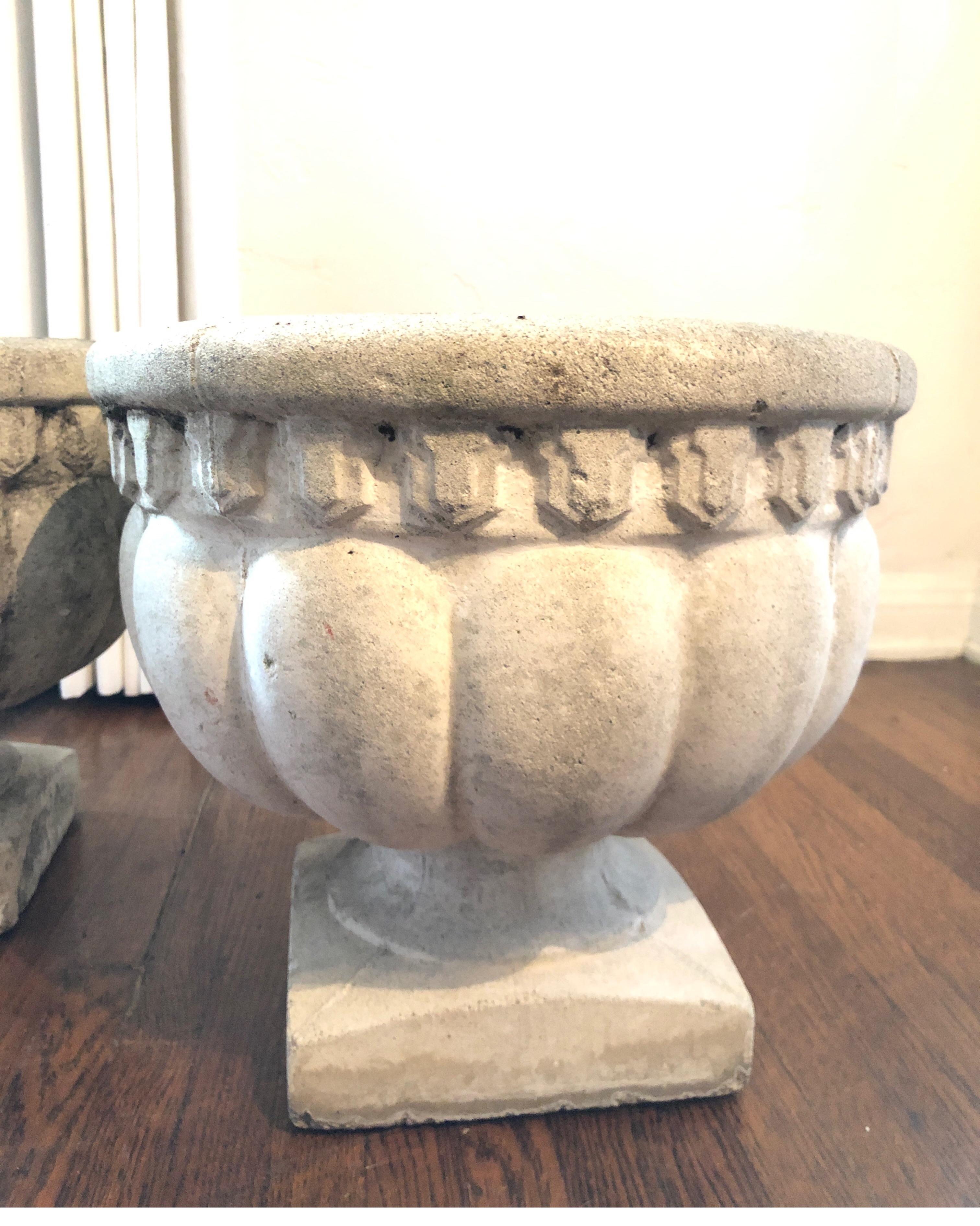 This pair of French cast stone urn planters have a lot of charm and will be an excellent touch at any space in your home design as stone planters or indoor vases. We have a matching third available if needed (See last pic and inquire within).
Each