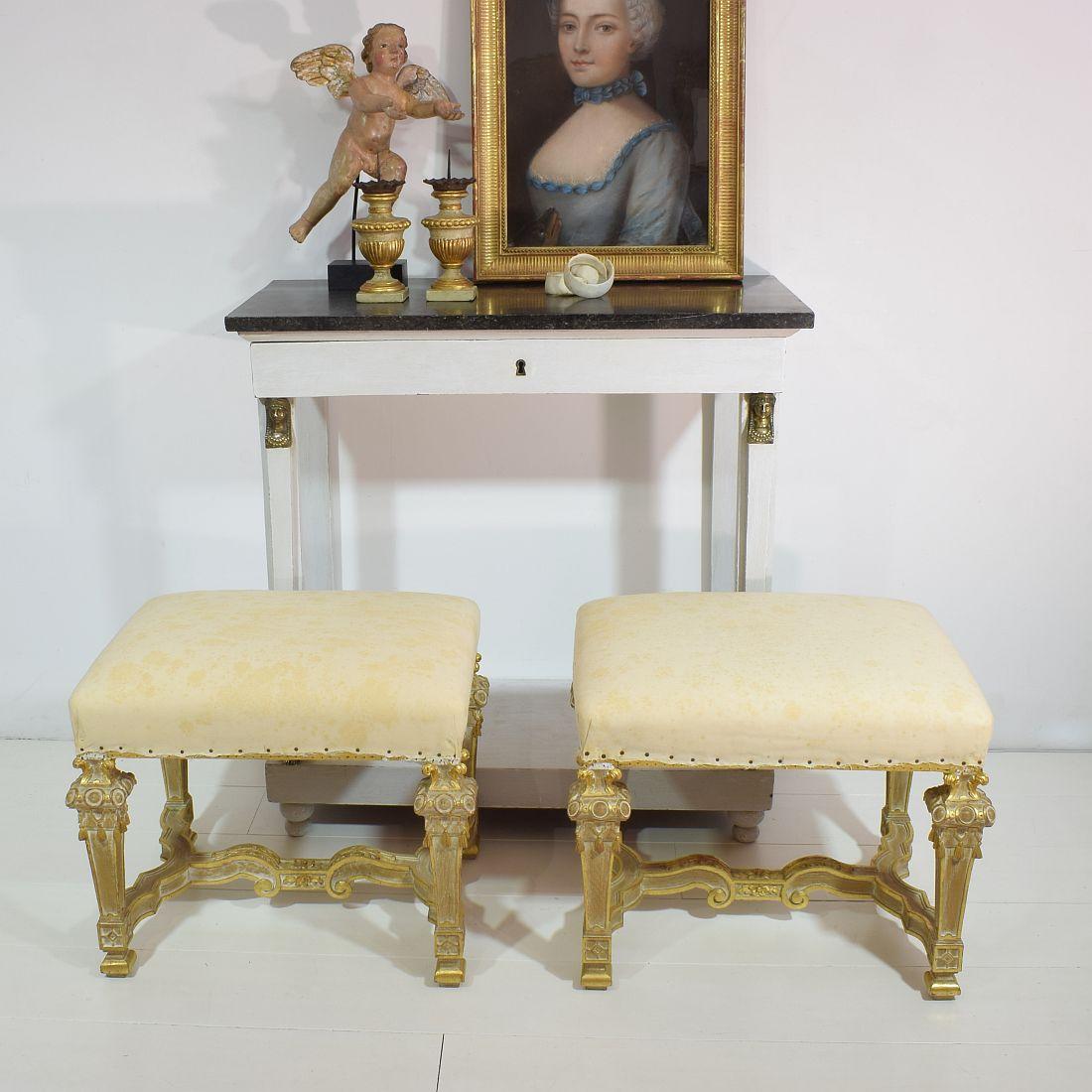 Beautiful pair of oak Louis XVI style carved stools or tabourets. Wonderful and very well hand carved. Partly gilded.
France, circa 1960, weathered. Ready for re-upholstery. 
 