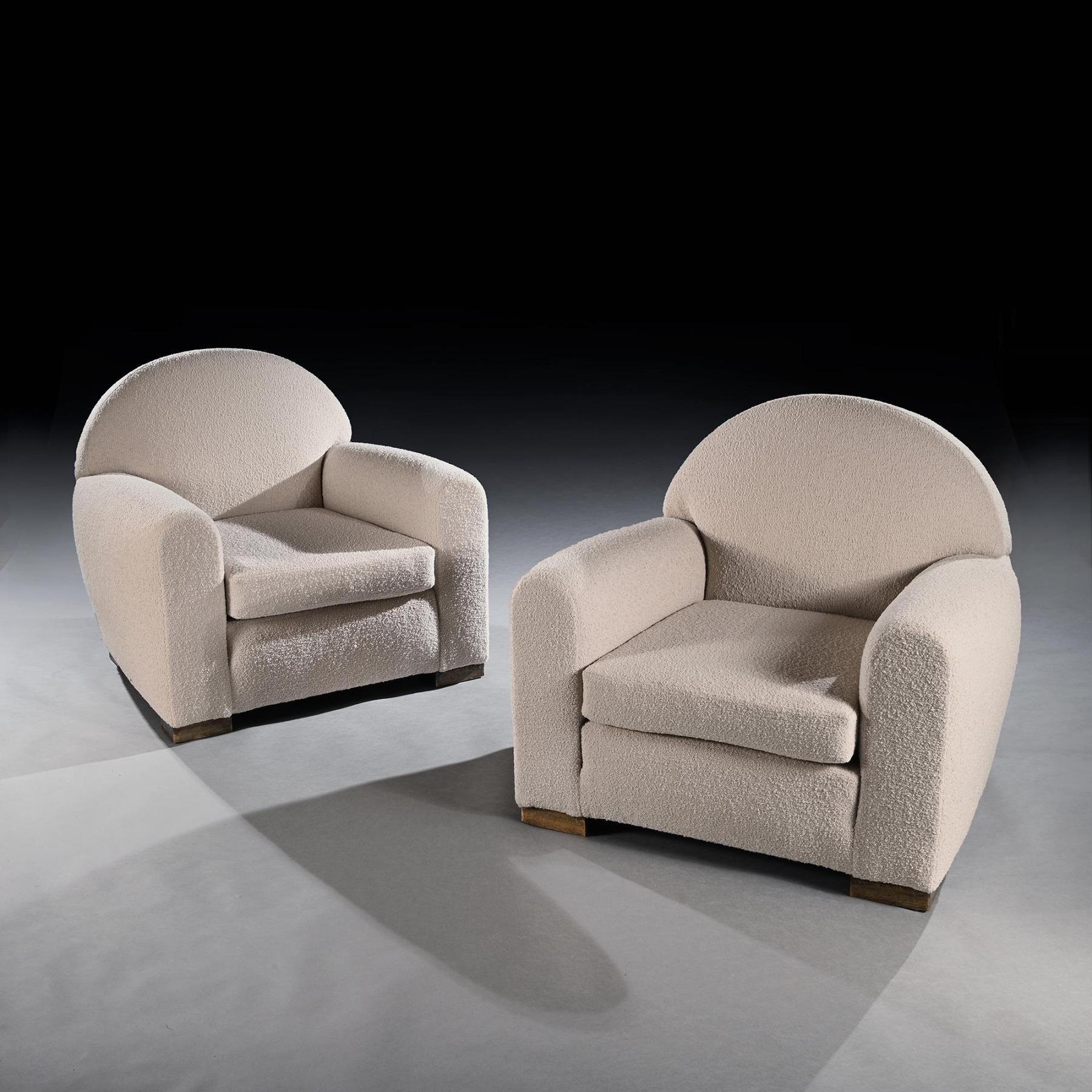 A Pair of Fine Parisian Club Armchairs, Mid 20th Century In the Style of Jean Royère and Jean-Michel Frank.

French most definitely Parisian circa 1940-50. 

The chairs of deep and comfortable form with cloud-shaped rising seat backs and arm