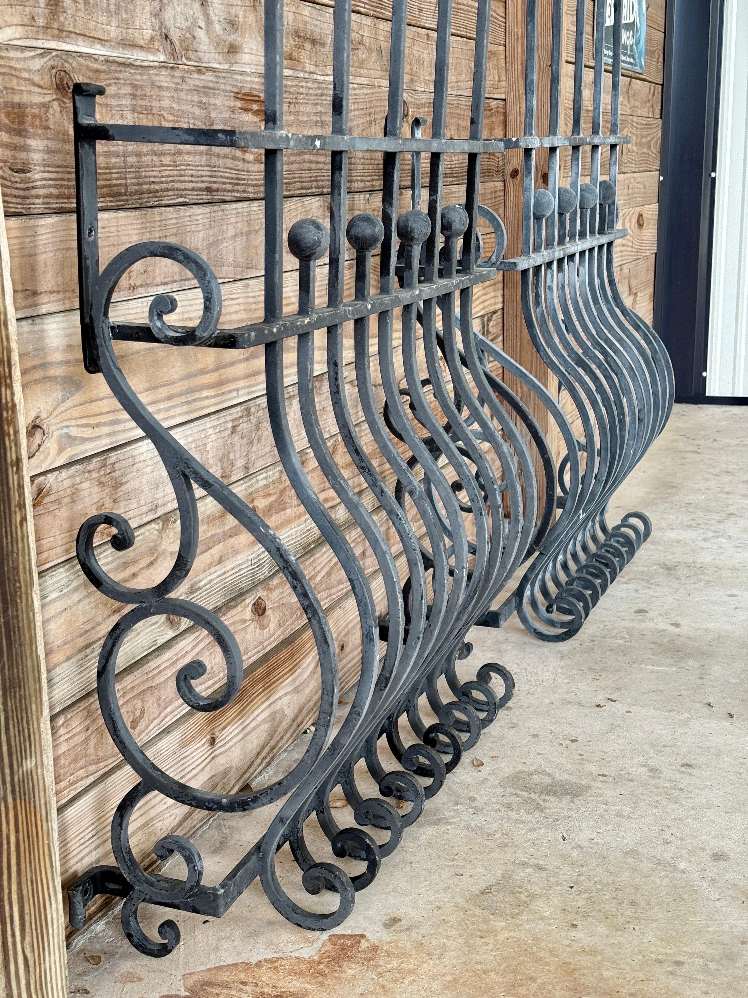 Hand-Crafted Pair of Mid-20th Century Hand-Forged Iron Window Grilles With Sculptural Scrollw