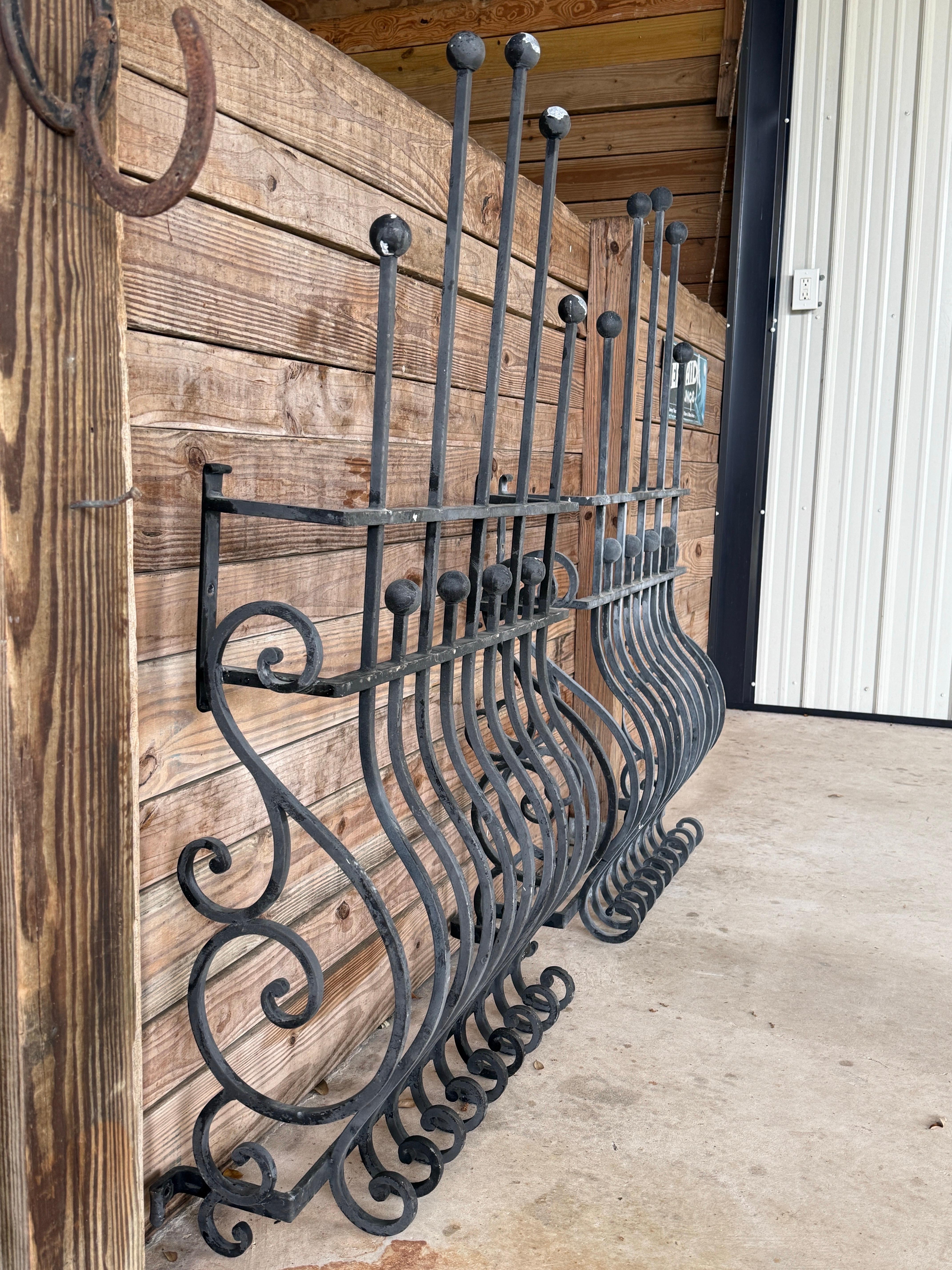 Pair of Mid-20th Century Hand-Forged Iron Window Grilles With Sculptural Scrollw In Good Condition In North Fort Myers, FL
