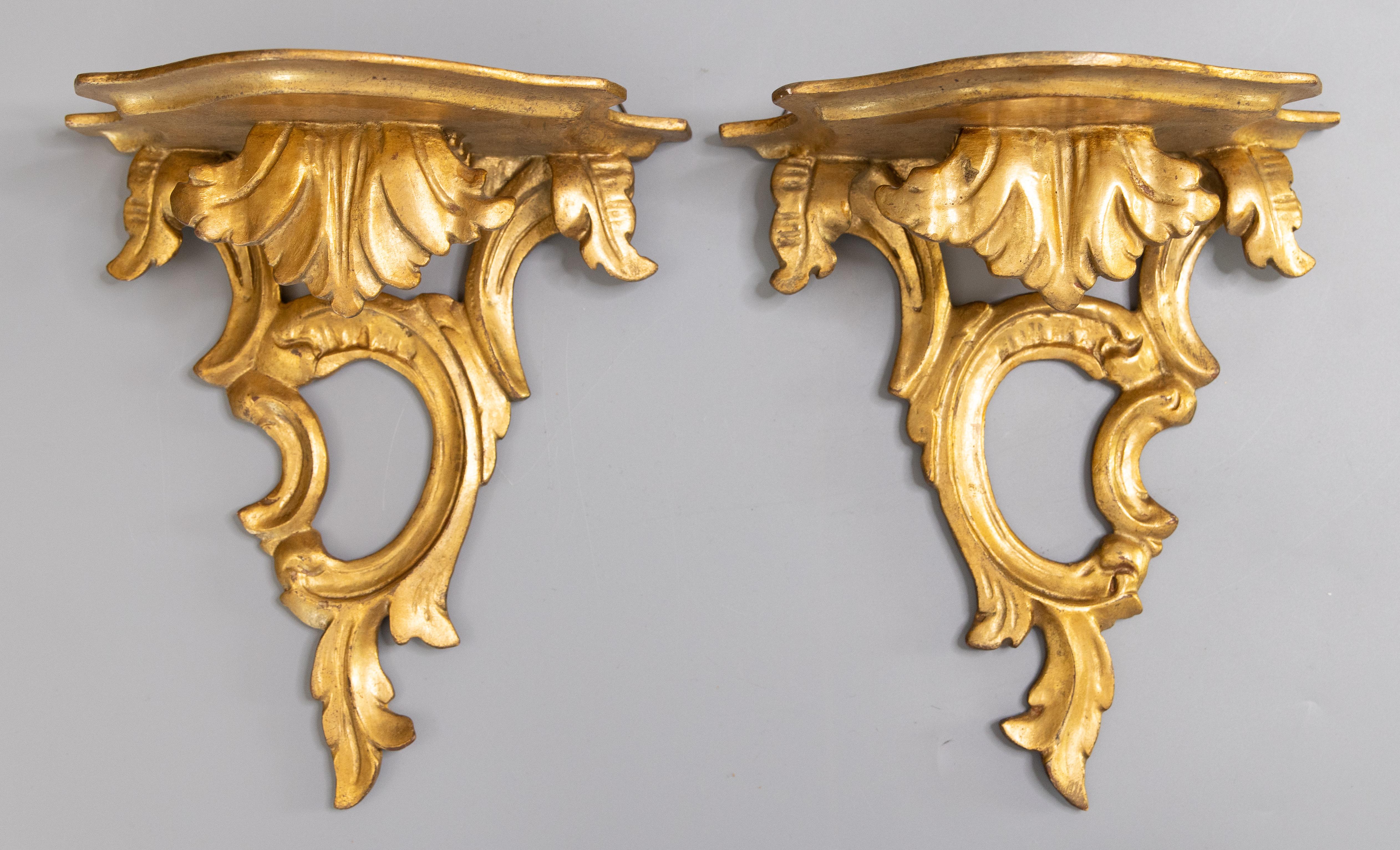A lovely pair of midcentury Italian gilded wood wall brackets shelves. Marked 