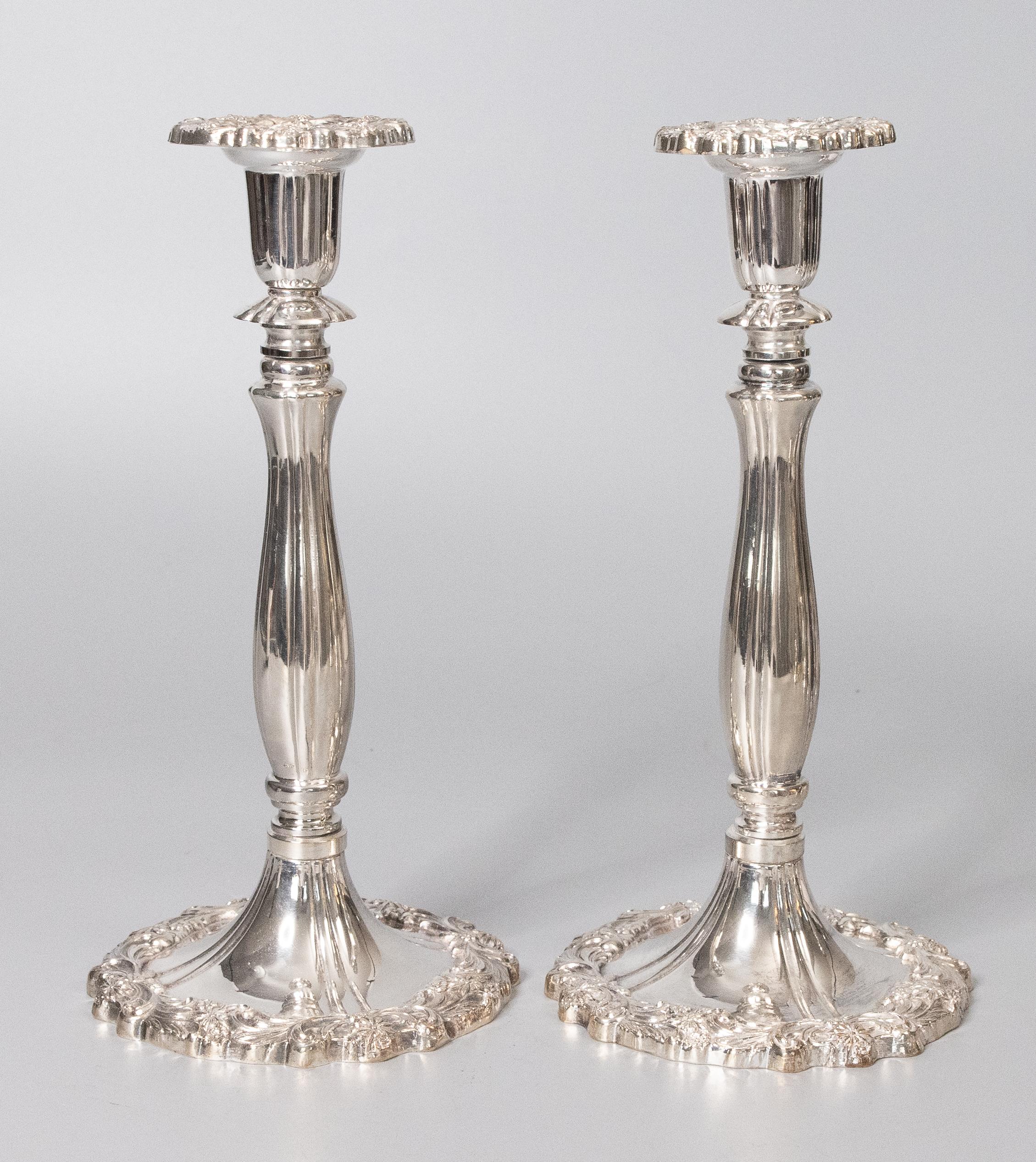 A stunning pair of vintage Mid-20th Century Rococo style silverplate candlesticks, made in Italy. Maker's mark on reverse. These gorgeous candle holders are a nice tall size and heavy with an ornate design.

Dimensions
5.25
