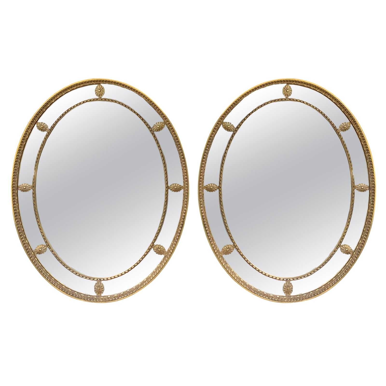 Pair of Mid-20th Century Oval Giltwood George III Style Oval Mirrors circa 1970s