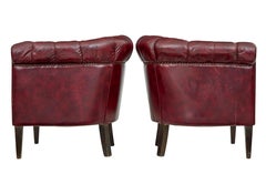 Pair of mid 20th century red leather club armchairs