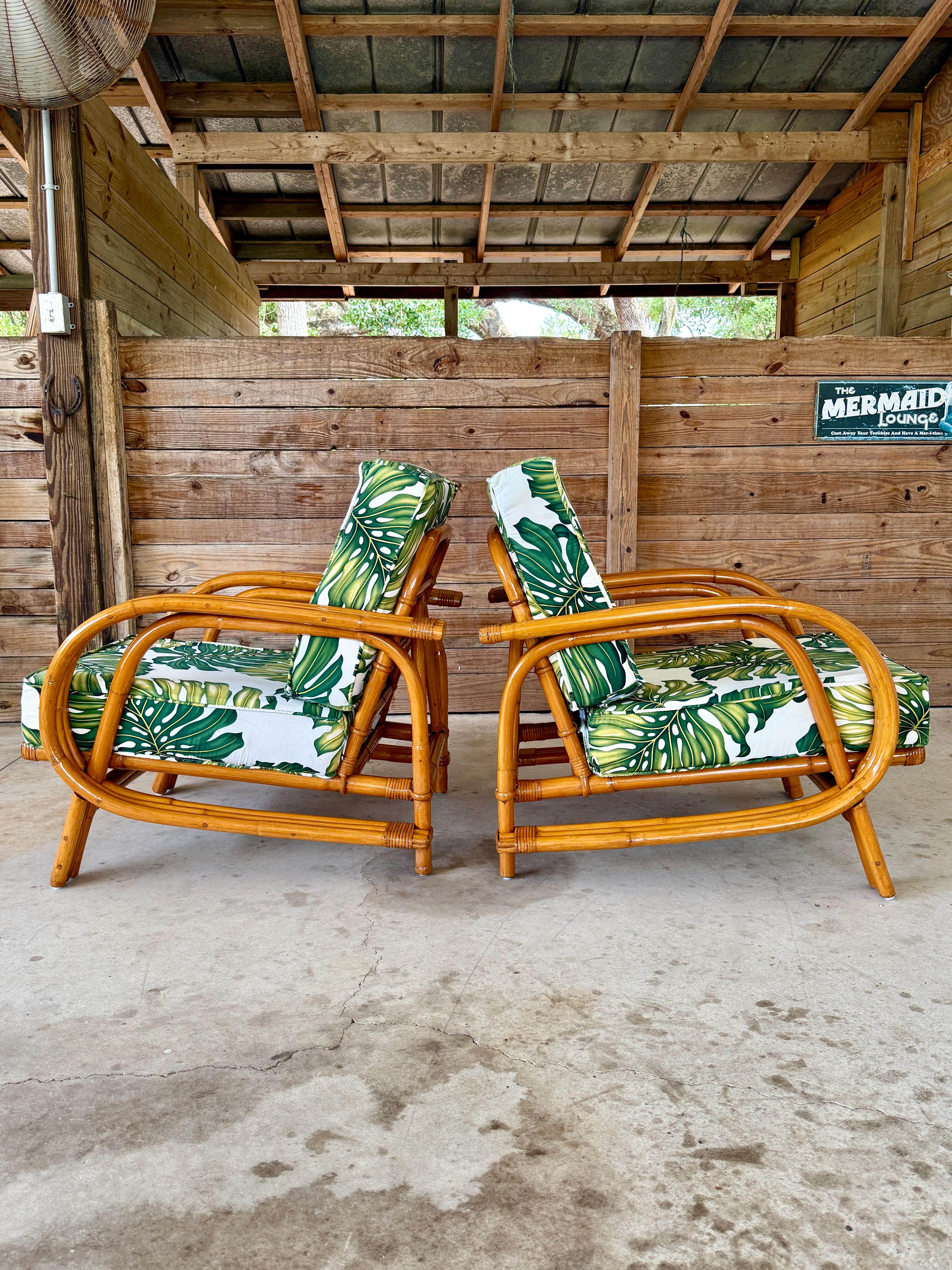 A vibrant pair of Mid-20th Century bent rattan lounge chairs, fully restored and refinished to highlight their curvaceous, organic frames.
The rattan has been cleaned, repaired, and refinished, though some wear remains consistent with age and