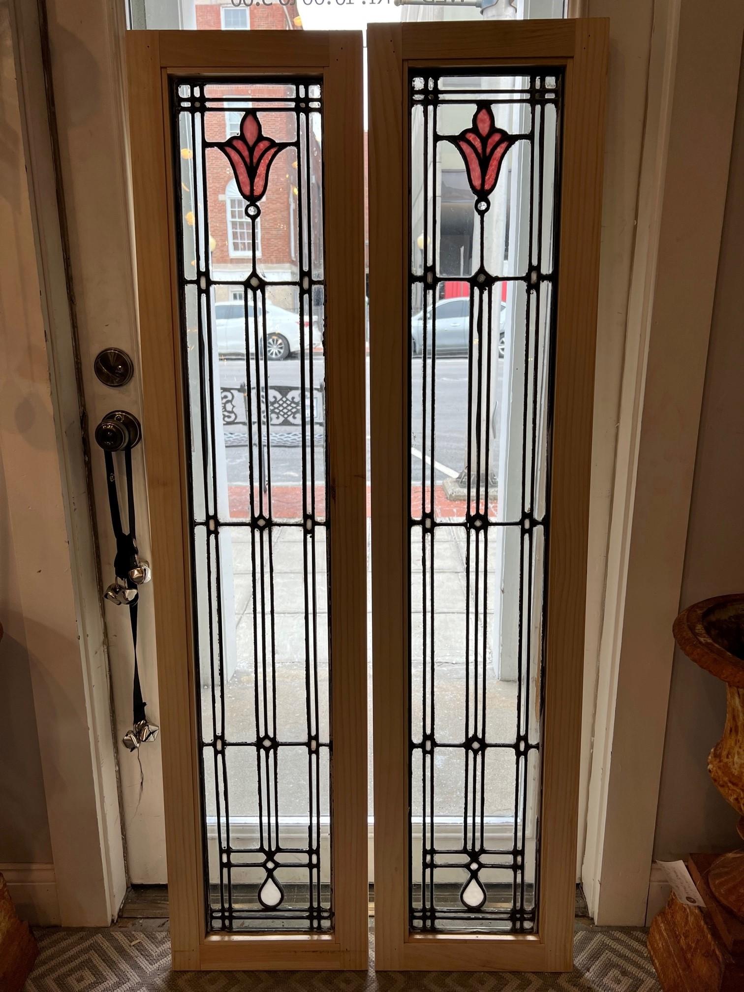Pair of Mid 20th century antique stained and clear glass sidelights possibly cabinet doors. This is a beautiful pair of straight lined zinc windows with a stained glass flower. I have two pairs available priced per pair. Zinc was used in doors and