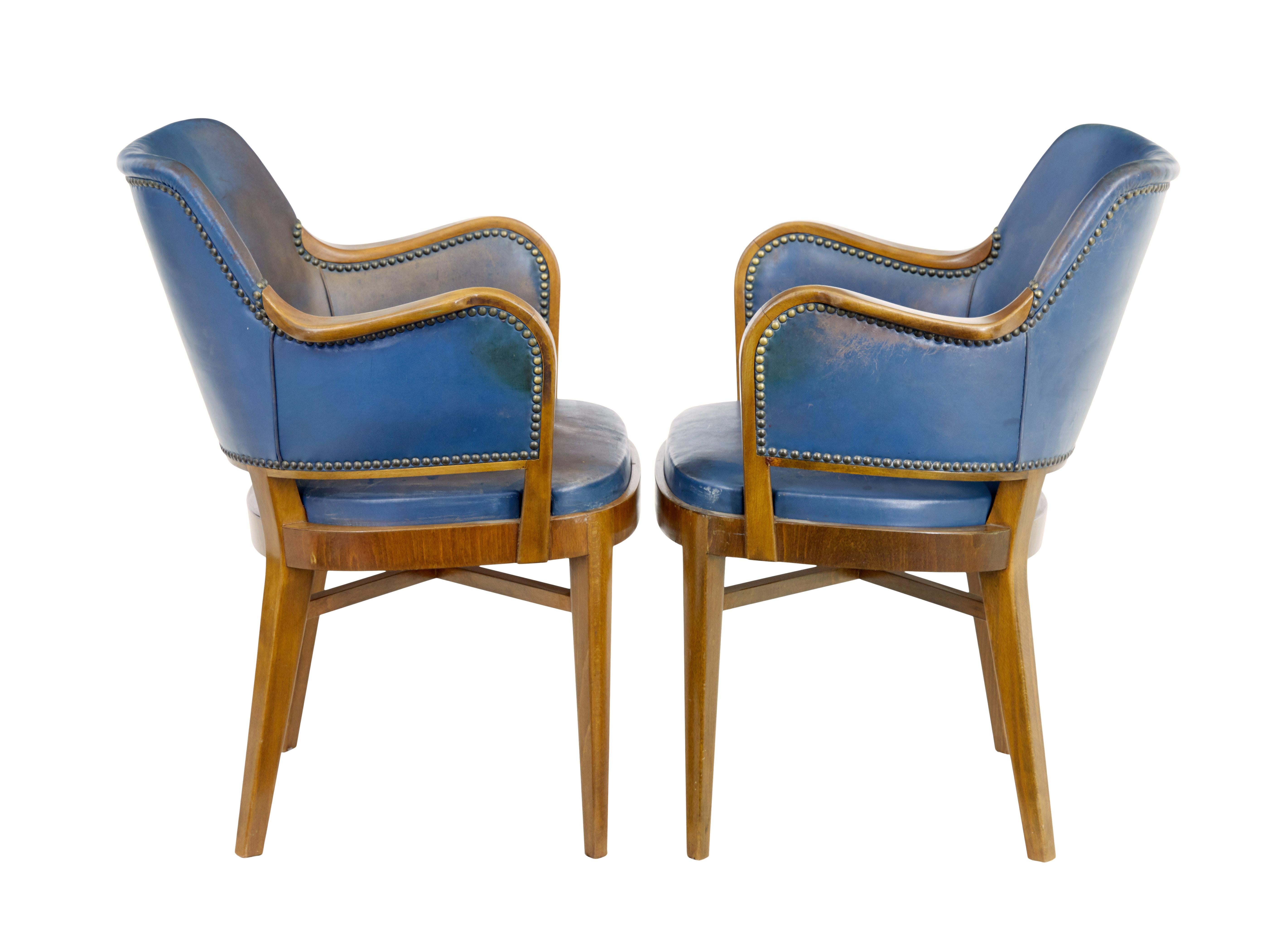 Mid-Century Modern Pair of mid 20th century teak and leather armchairs For Sale