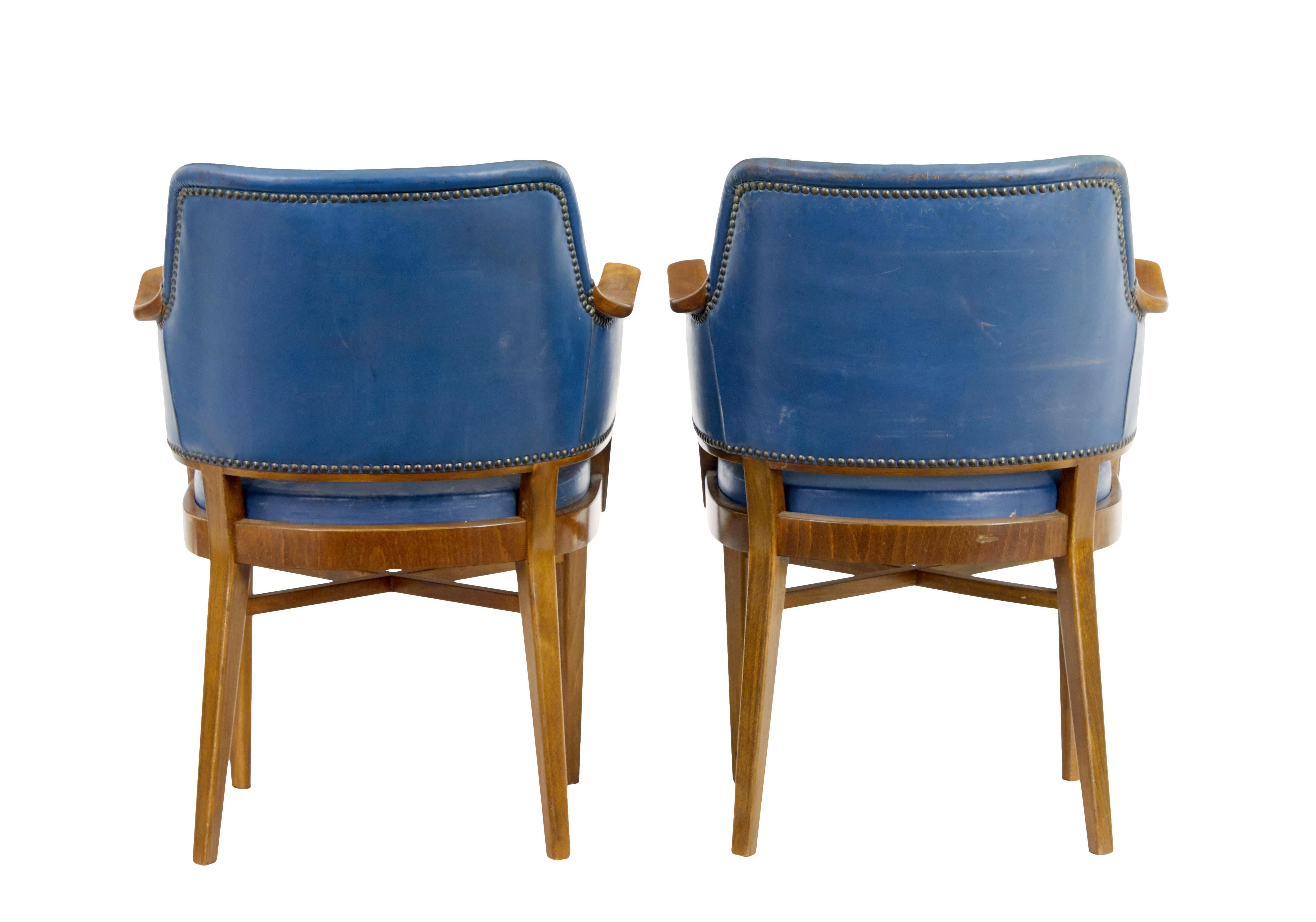 Swedish Pair of mid 20th century teak and leather armchairs For Sale