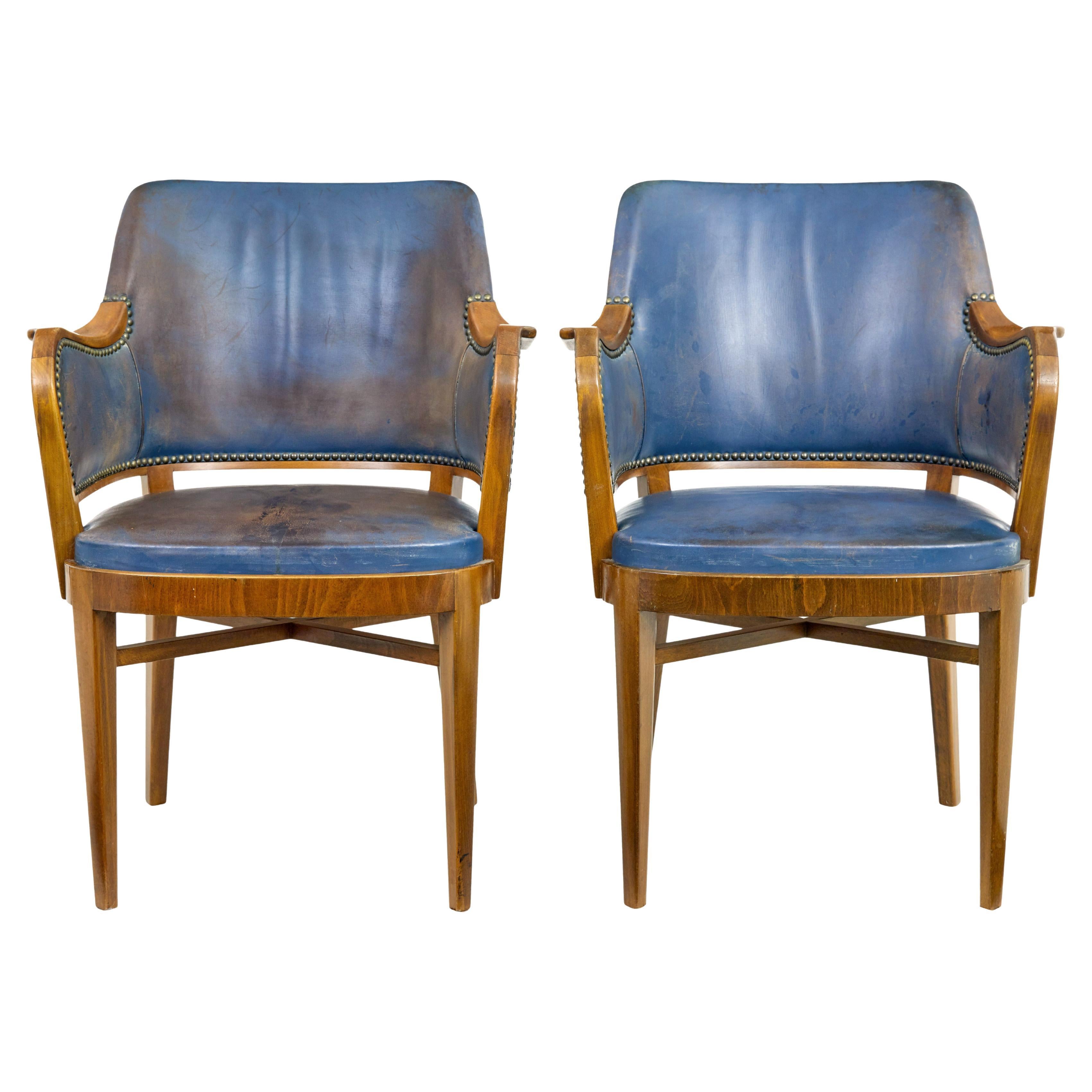 Pair of mid 20th century teak and leather armchairs For Sale