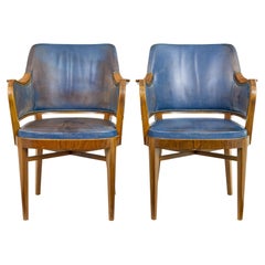 Paire de fauteuils en teck et cuir du milieu du 20e siècle