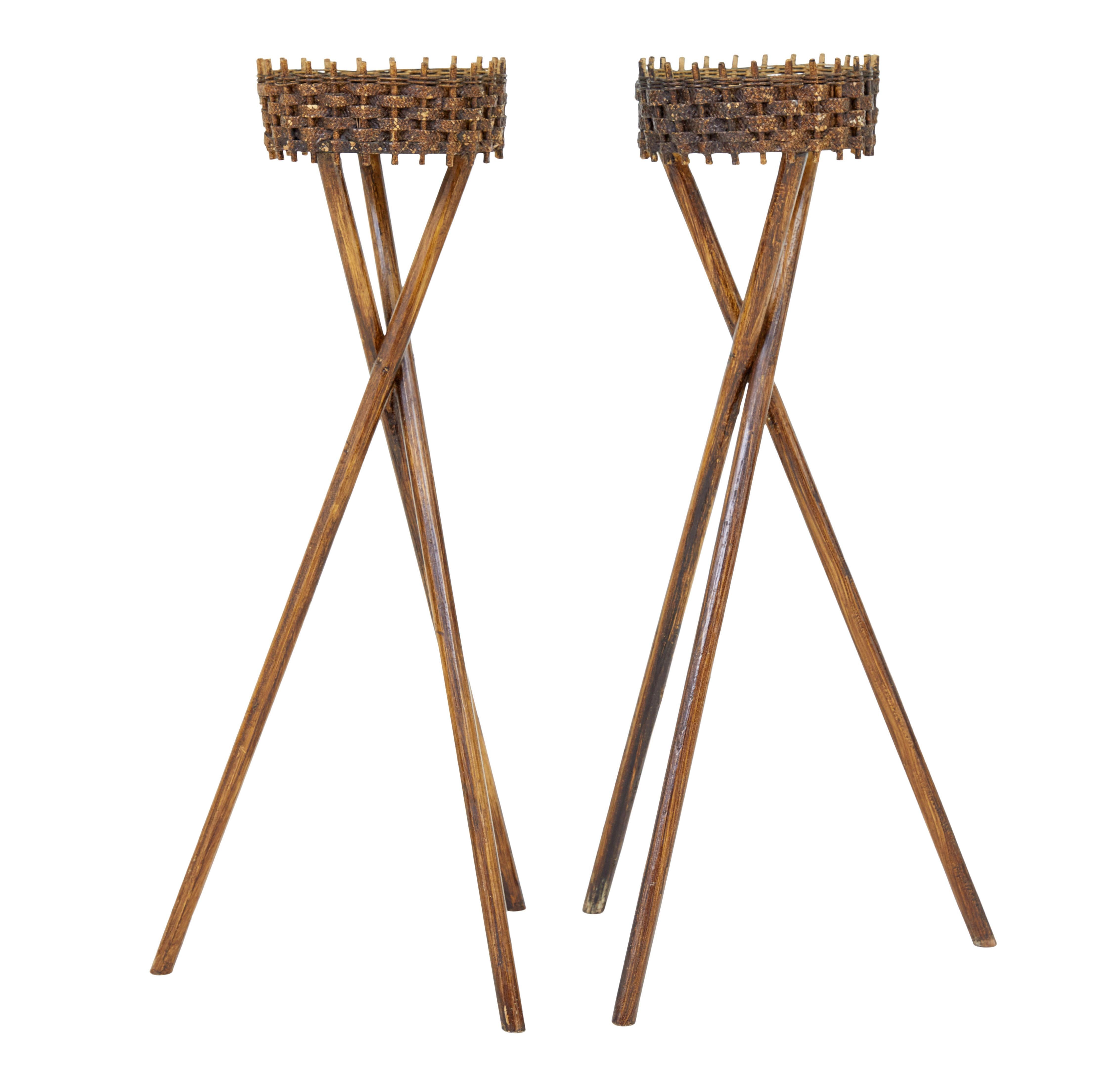 Pair of mid 20th century woven plant stands circa 1950.

Good quality pair of Swedish made woven cane plant stands.

Made using traditional techniques of weaving between wooden pegs to form a circular container for plant pots.  Supported by a tripod