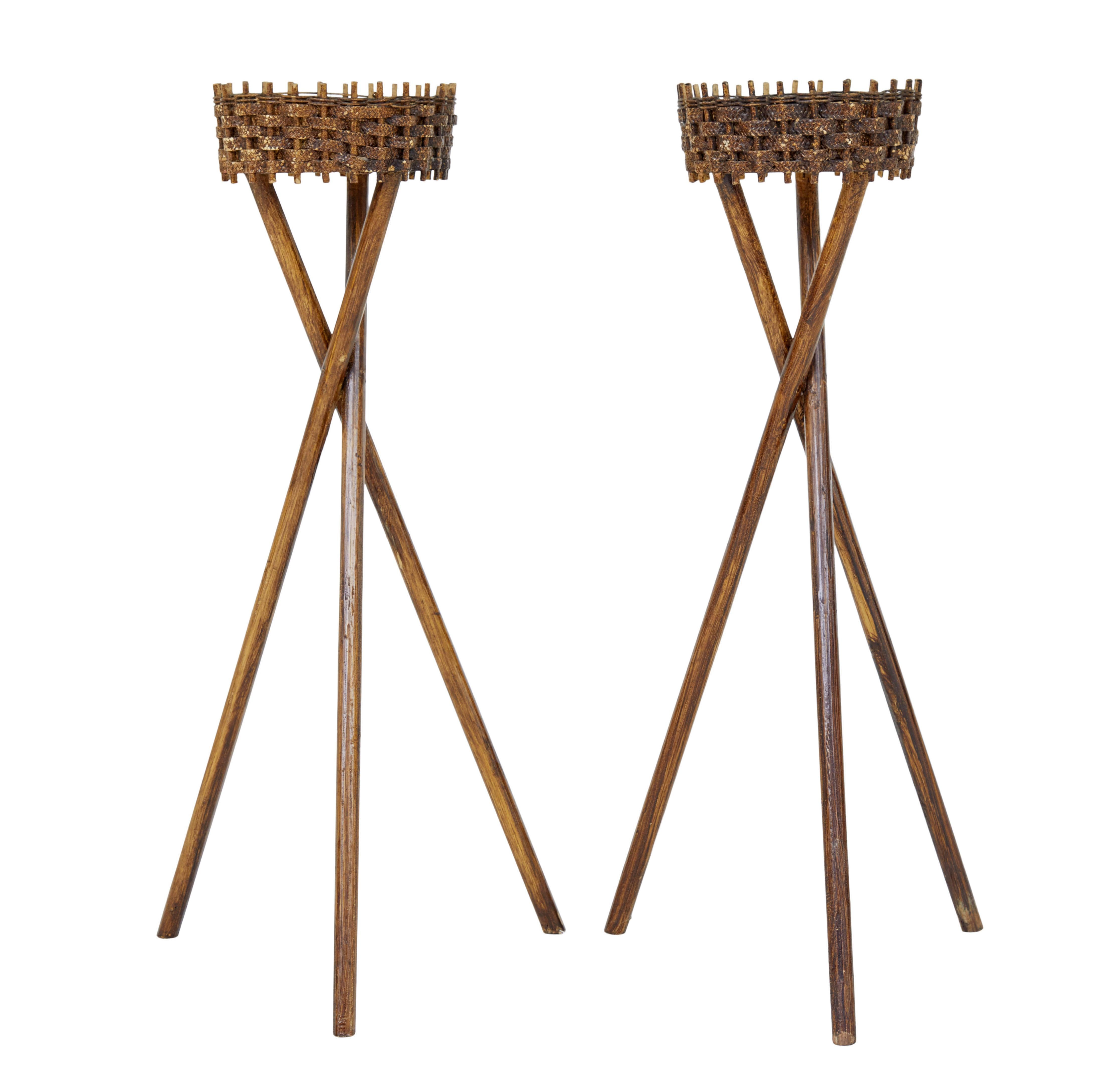 Pair of mid 20th century woven plant stands circa 1950.

Good quality pair of swedish made woven cane plant stands.

Made using traditional techniques of weaving between wooden pegs to form a circular container for plant pots.  Supported by a tripod