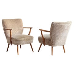 Pair of mid century 1950's Scandinavian cocktail armchairs with new upholstery