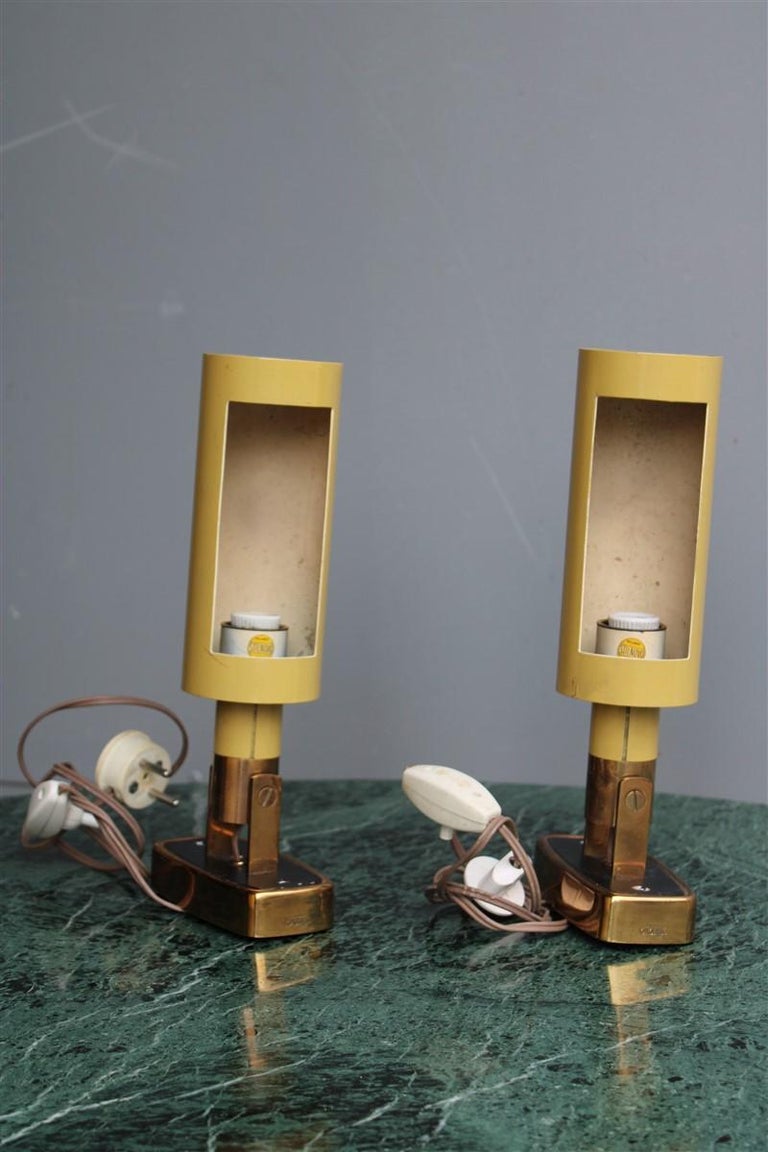 Pair of mid-century adjustable Stilnovo bedside wall lamps in lacquered yellow.
