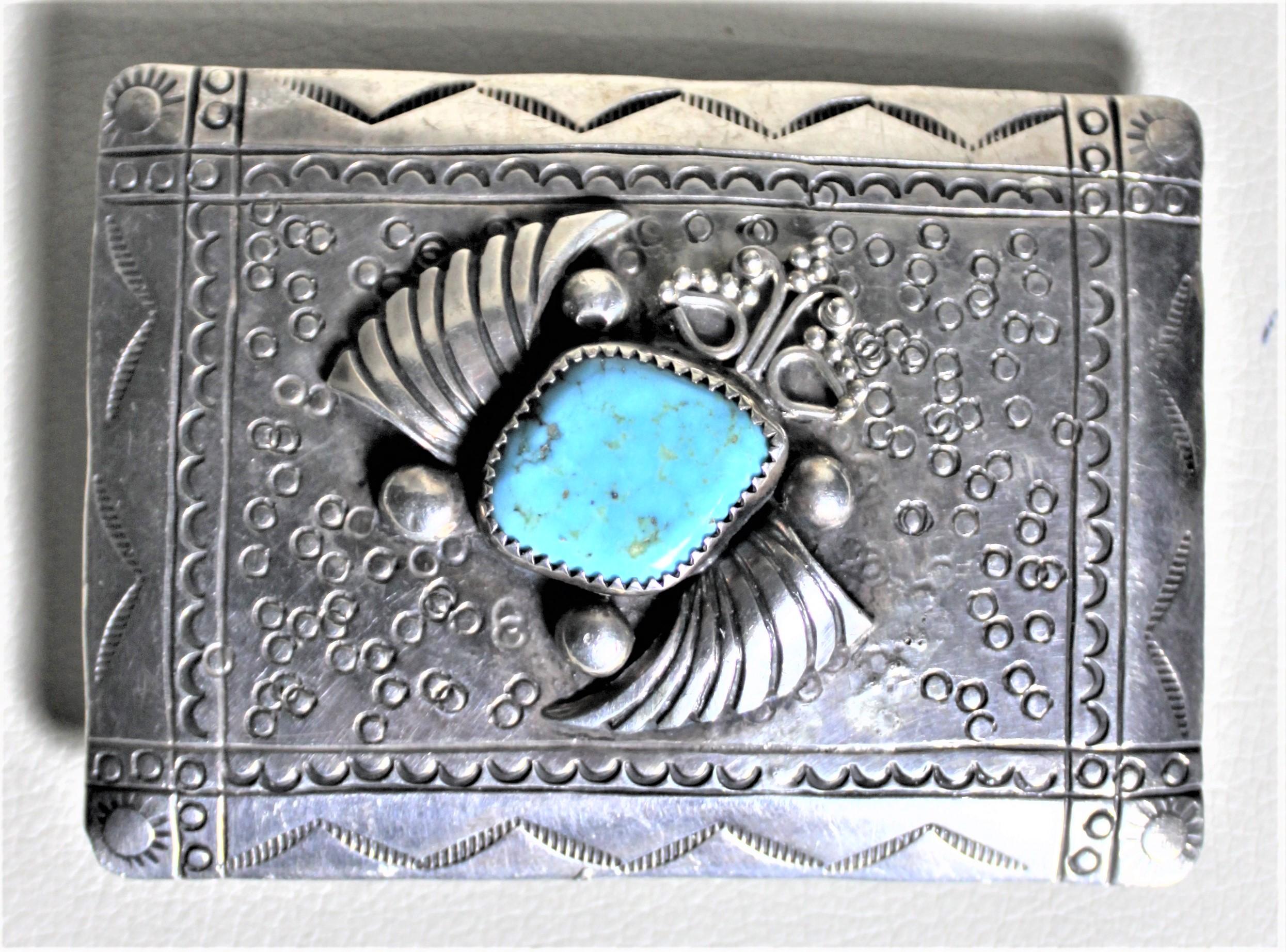 silver belt buckle with turquoise