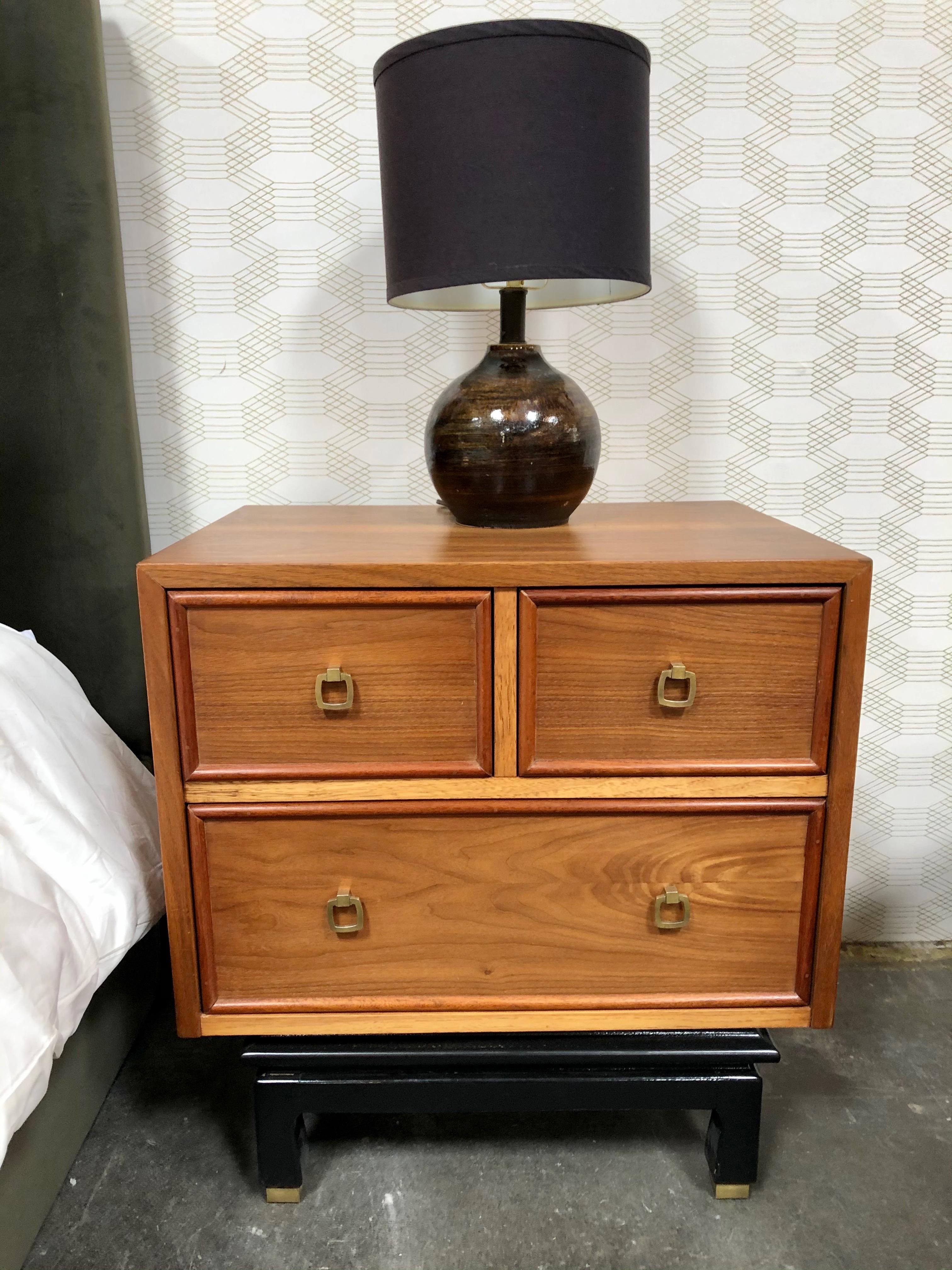 This set is sold as a pair. Each nightstand comes in a light stain wood color and features three pull out drawers each: two smaller drawers on the top and one larger one on the bottom (see photo).