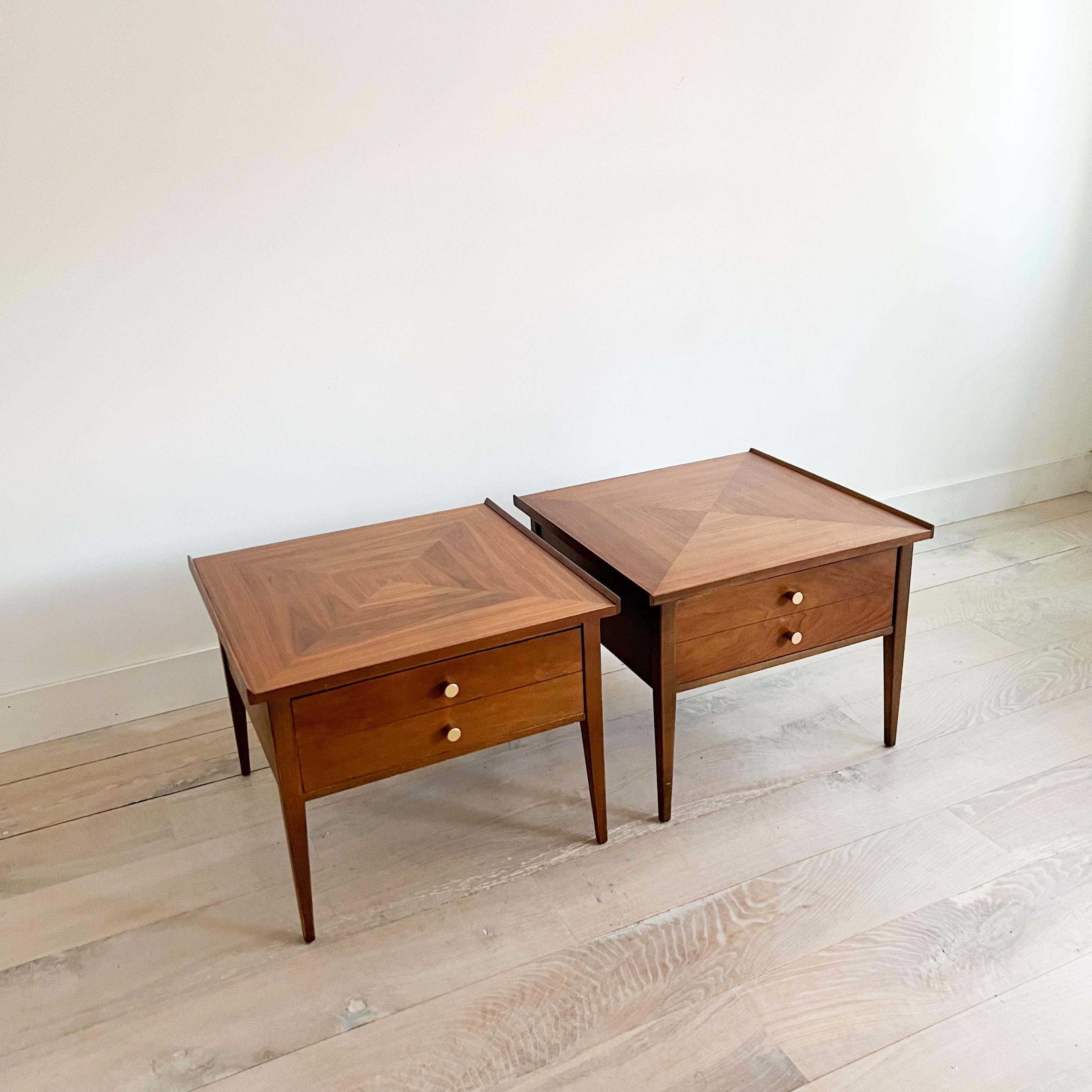 Pair of mid century modern walnut end tables by American of Martinsville. New brass drawer pulls. The tops have been sanded and restored. Stunning wood grain! Some light scuffing/scratching from age appropriate wear.

25.75”x25” 20.5”H