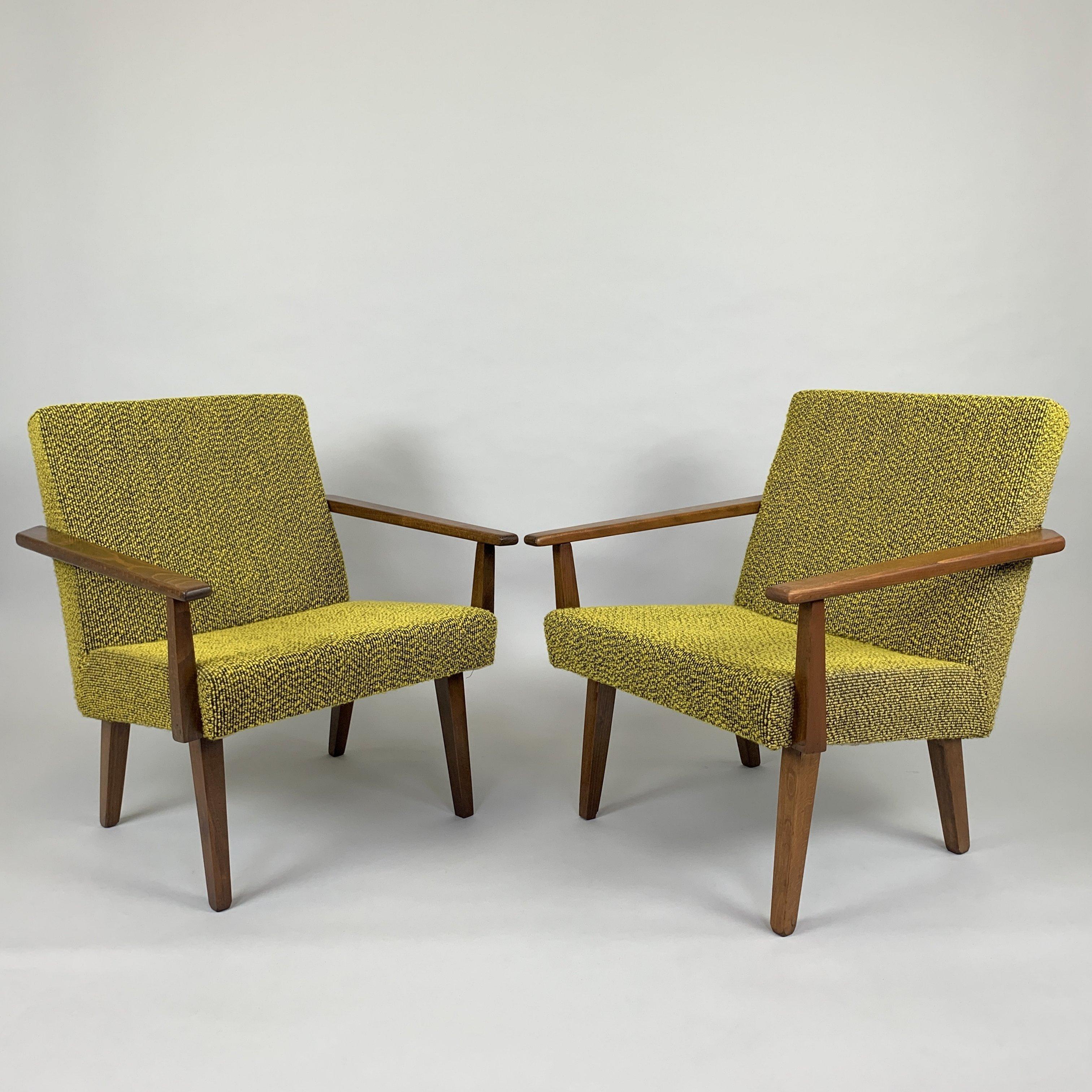 Pair of lovely vintage armchairs made in former Czechoslovakia in 1960's. The wooden parts were refurbished. Upholstery is in original, well-preserved condition.