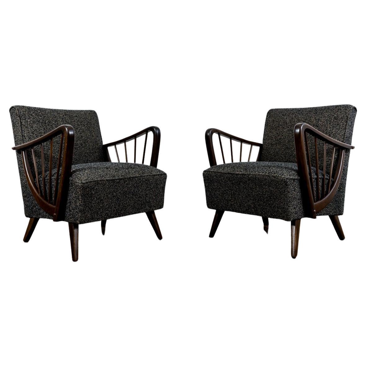 Pair of large Mid-Century armchairs 1950's Germany.
Solid wood legs and harp-shaped armrest have been completely restored and refinished.
Reupholstered in high quality black grey boucle type of fabric.