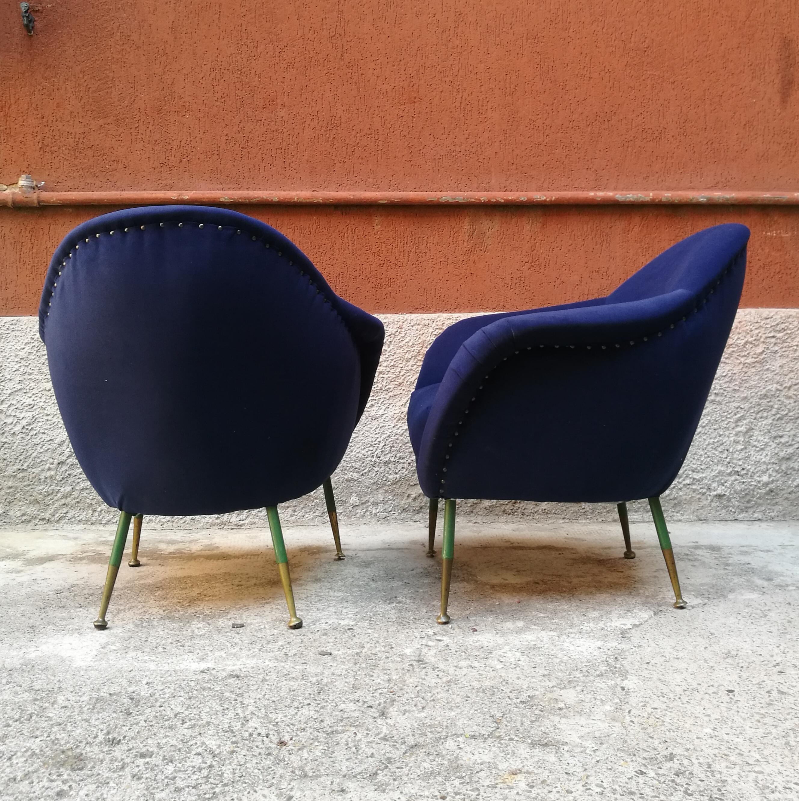 Pair of midcentury armchairs in fabric blu with green legs and brass, 1960s
This pair of armchairs have a structure in solid wood completely restored and in perfect conditions.
The legs green with end legs in brass are original.
 