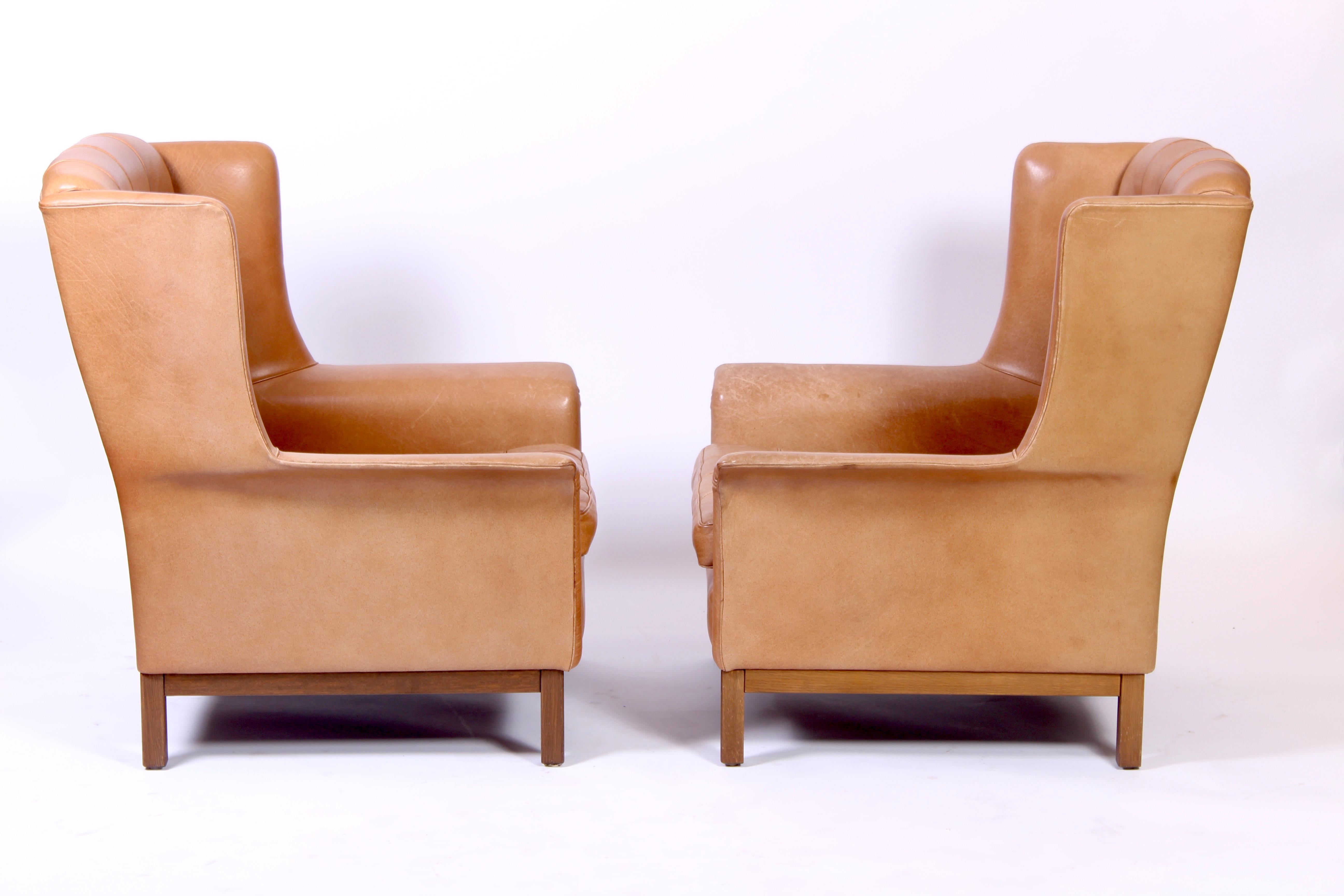 Scandinavian Modern Pair of Midcentury Arne Norell Lounge Chairs with Ottoman, 1960s For Sale