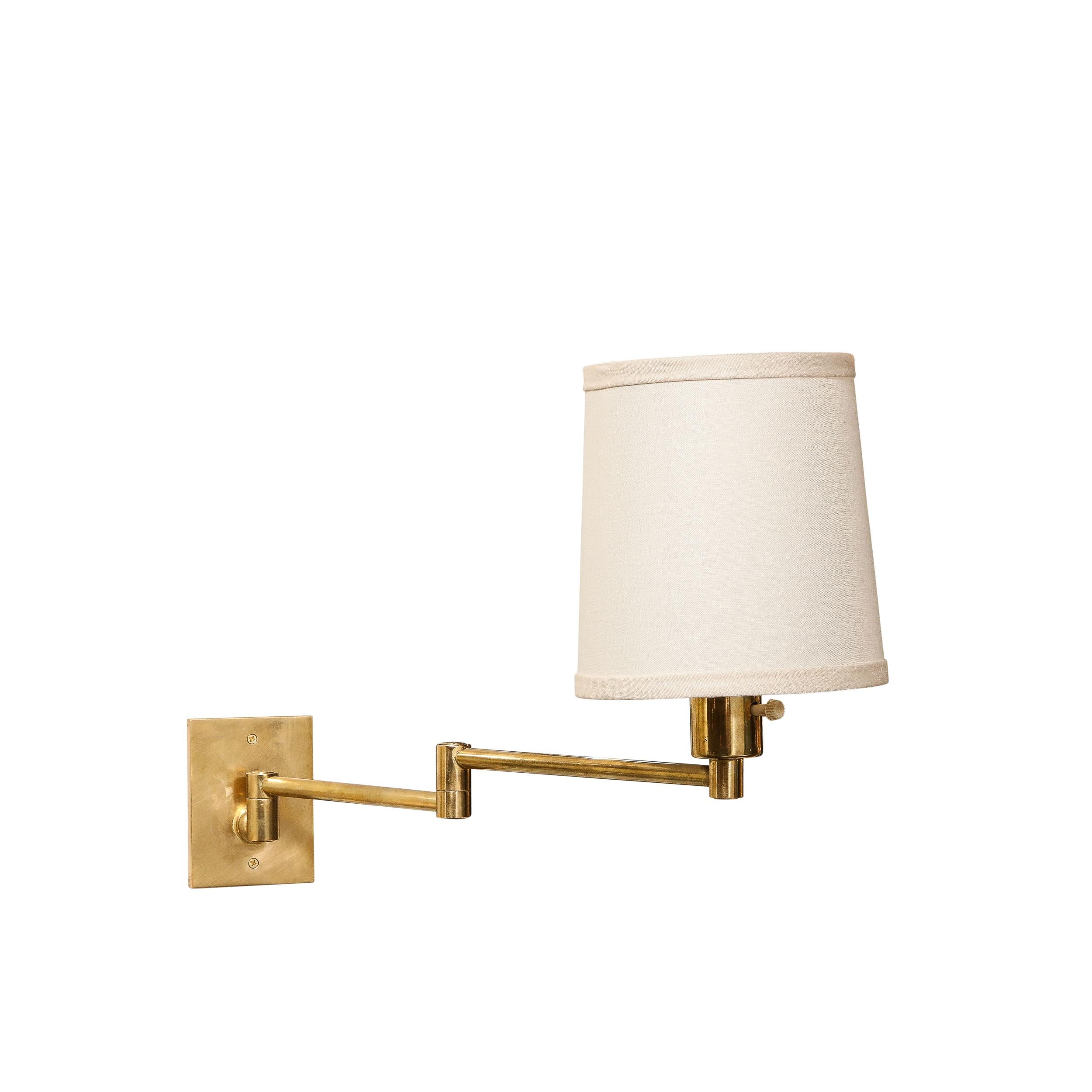 This brilliant pair of Mid-Century Modernist Articulating Wall Sconces in Polished Brass by George W. Hansen for Metalarte originate from Spain, Circa 1970. Featuring a beautiful geometric construction in polished brass with two cylindrical hinged
