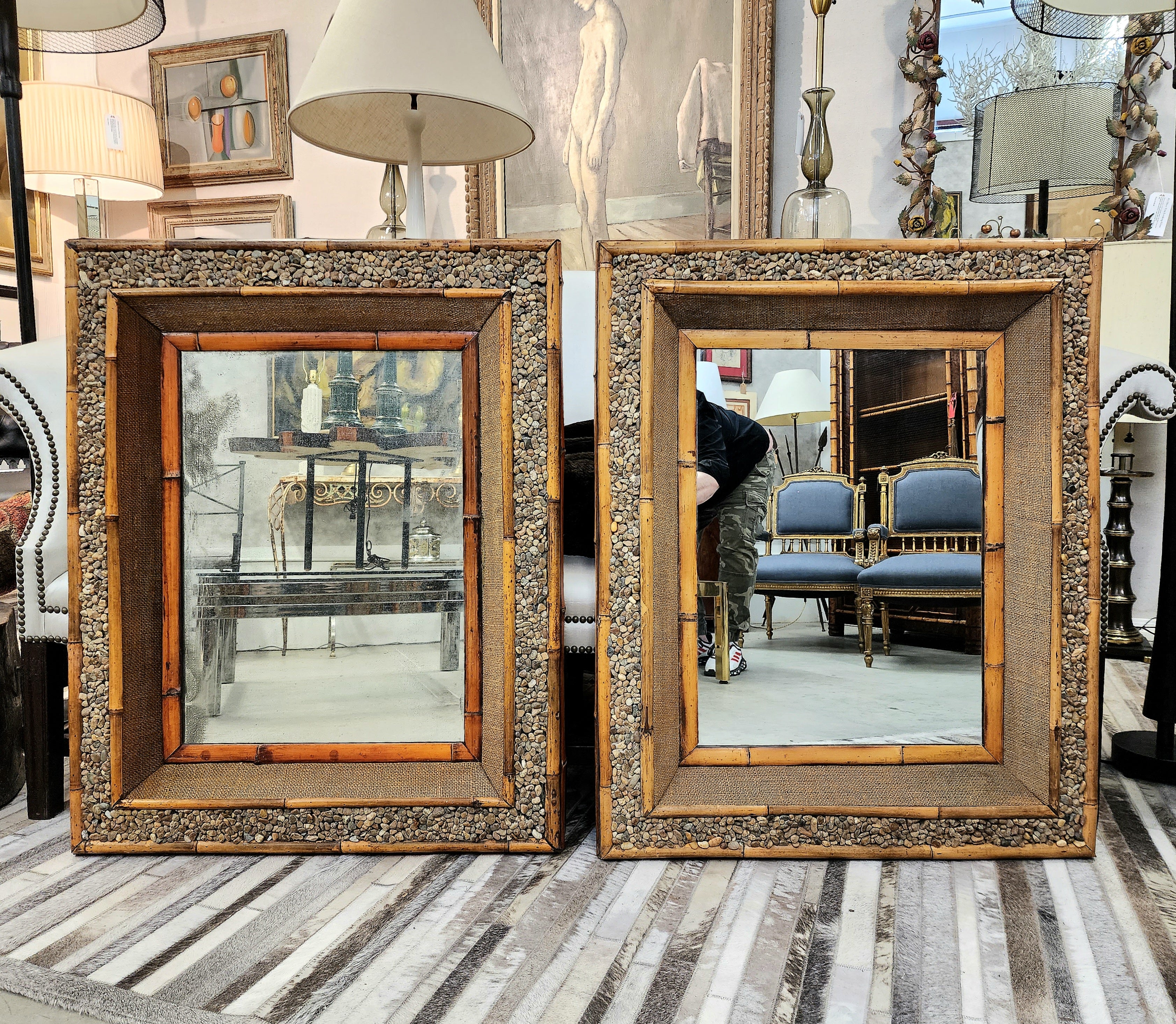 Very handsome pair of exceptional bamboo and pebble stone mirrors.
Circa 1940's, just full of character and texture.
Perfect for a master bathroom Suite or a pair of console tables. All bamboo and textured surfaces are original.

