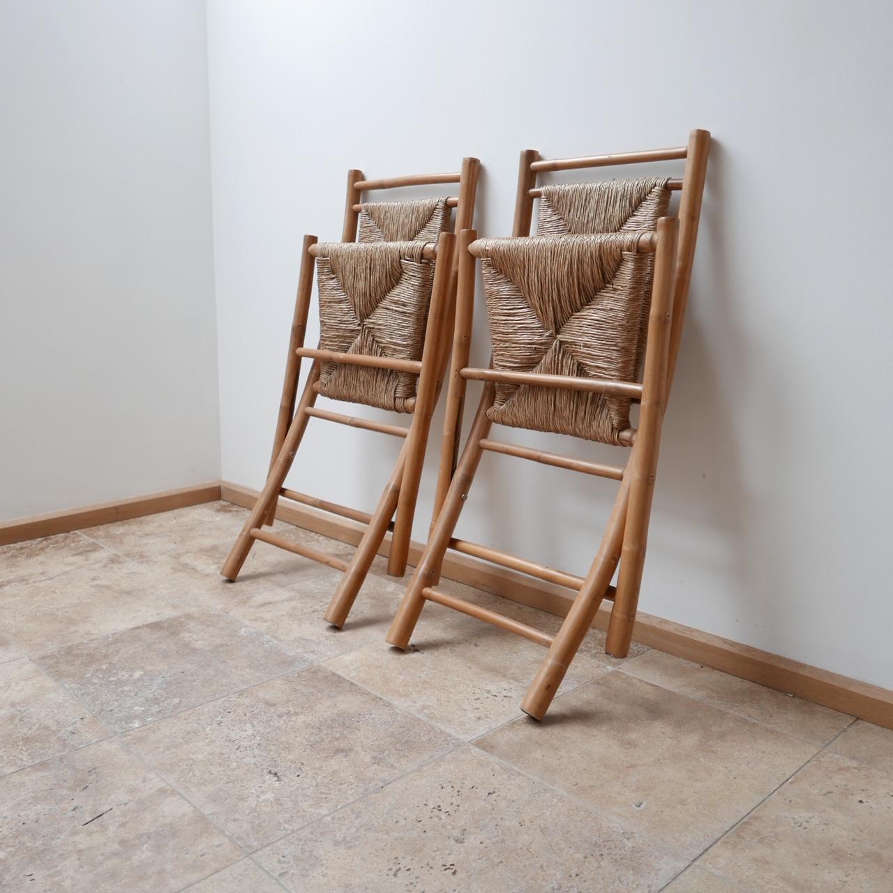 A stylish pair of rush occasional chairs.

Foldable, solid bamboo, rush seats and back.

English, circa 1960s.

Very good condition.

Price is for the pair.

Dimensions: 51 W x 60 D x 48 seat height x 96 total height in cm.

  