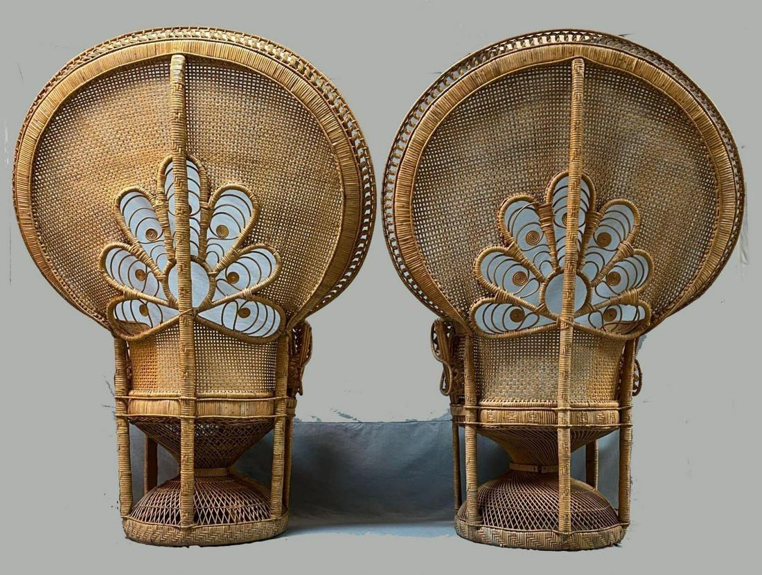 A pair of gorgeous Bohemian-styled peacock chairs made out of woven rattan and wicker. The back features intricate woven detailing, circa 1970s.

Dimensions: 60