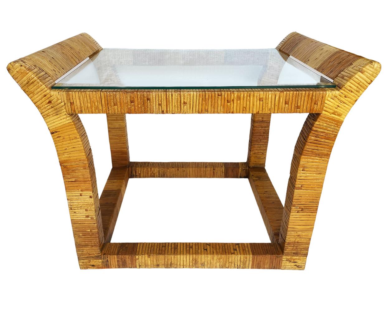 A matching pair of rattan tables that are funky cute & coastal modern. Heavy solid construction with clear inlayed glass. Very good ready to use condition. 