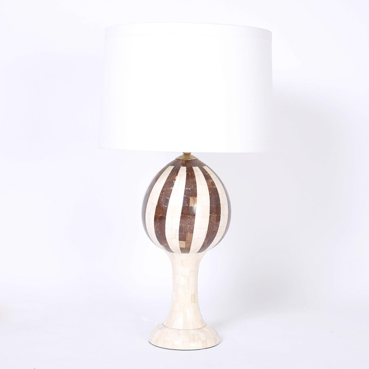 Pair of midcentury table lamps crafted in a mosaic of bone and coconut shell with a Classic gourd form reimagined in a modern spirit.