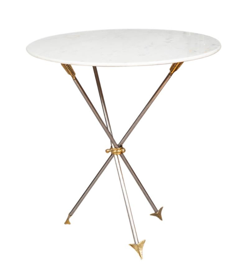 Each with circular white marble tops and raised on three steel arrow form legs.