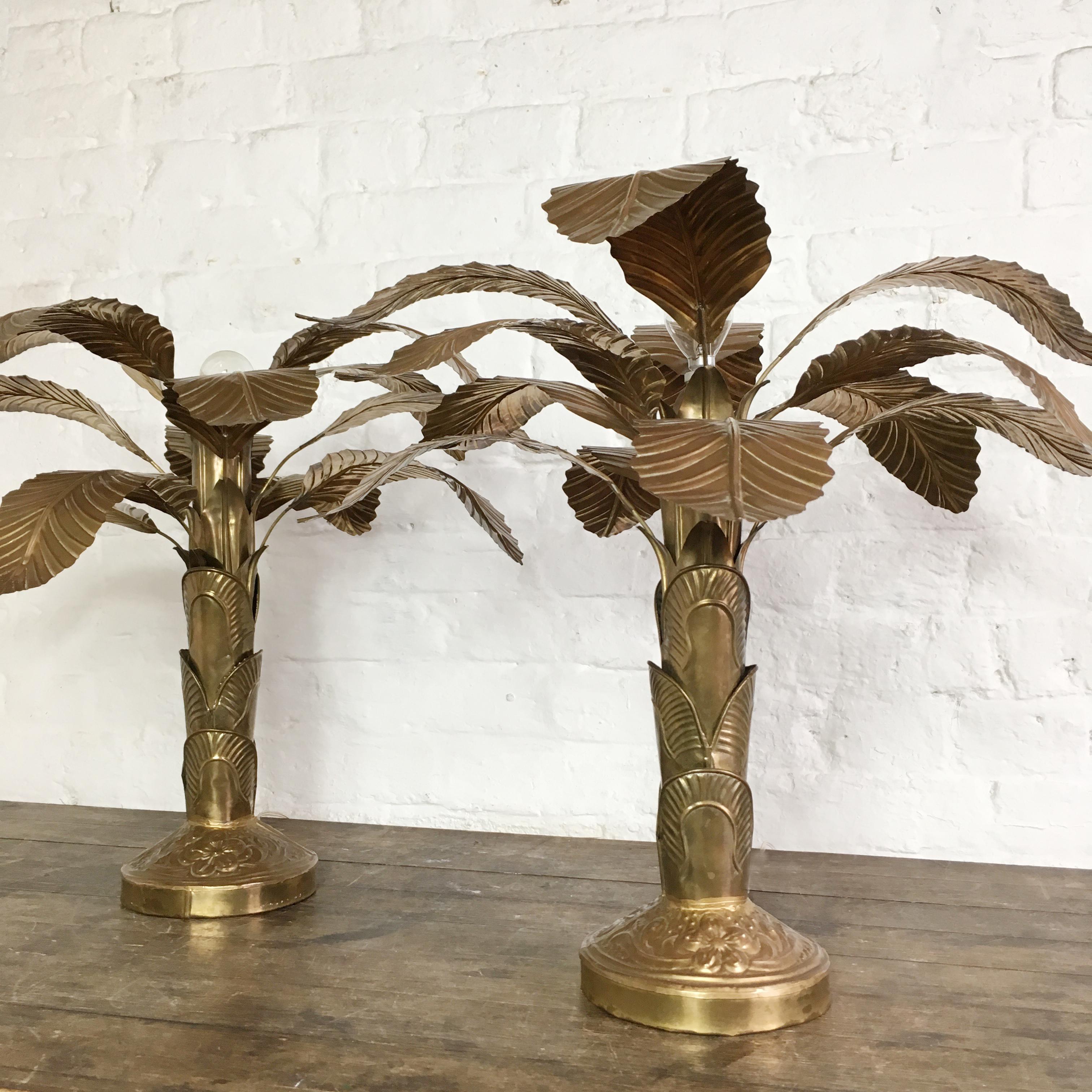A matching pair of brass banana palm tree table lamps,
circa 1960s-1970s
Each lamp is fully handcrafted, the stems and base are hand stamped and embossed with the design, the leaves are hand crafted with much detail.
The leaves are fully
