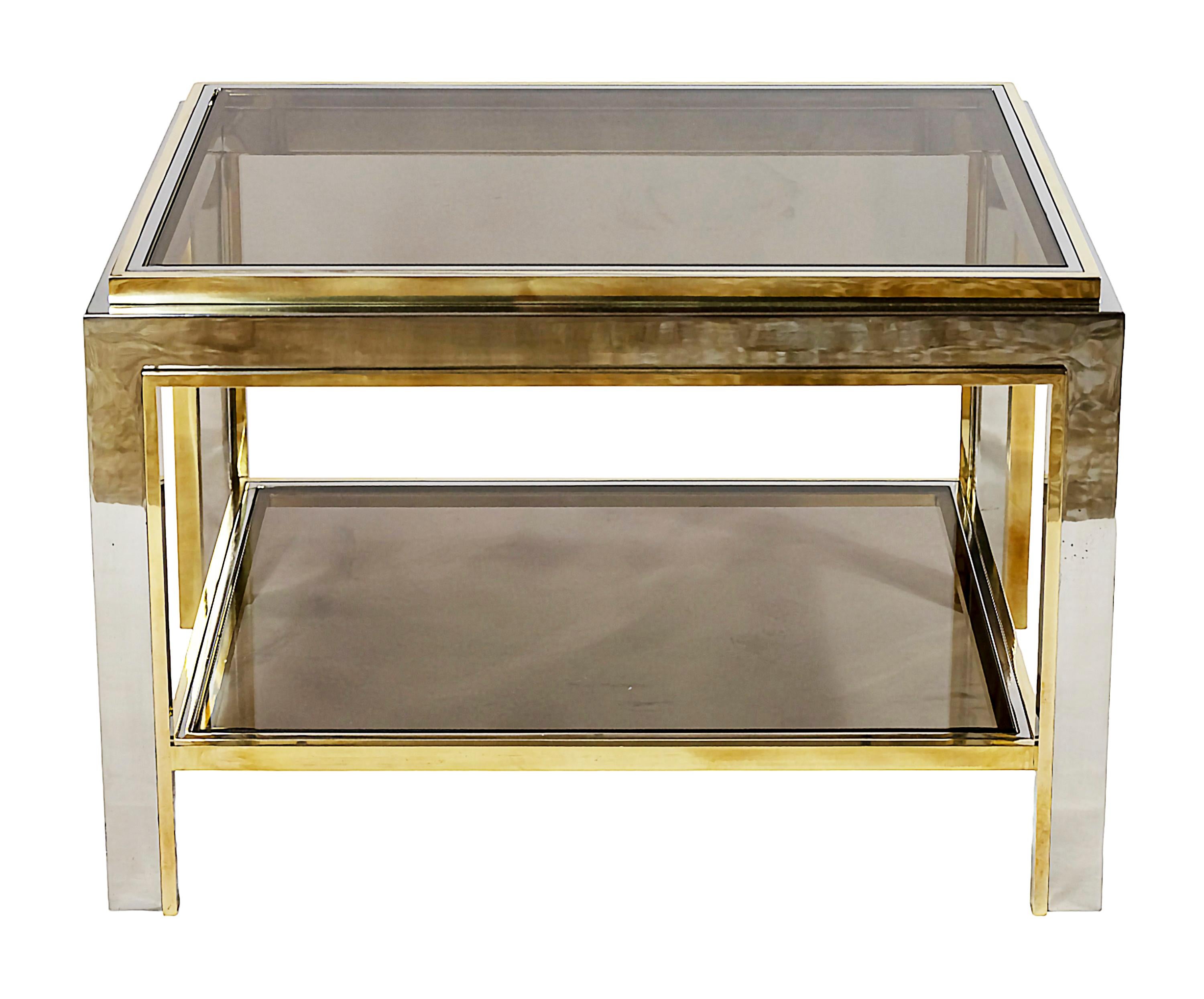 Pair of mid-century Italian side tables made of brass and chrome frame with smoked glass top and lower shelves.
Heavy and solid, very good condition.