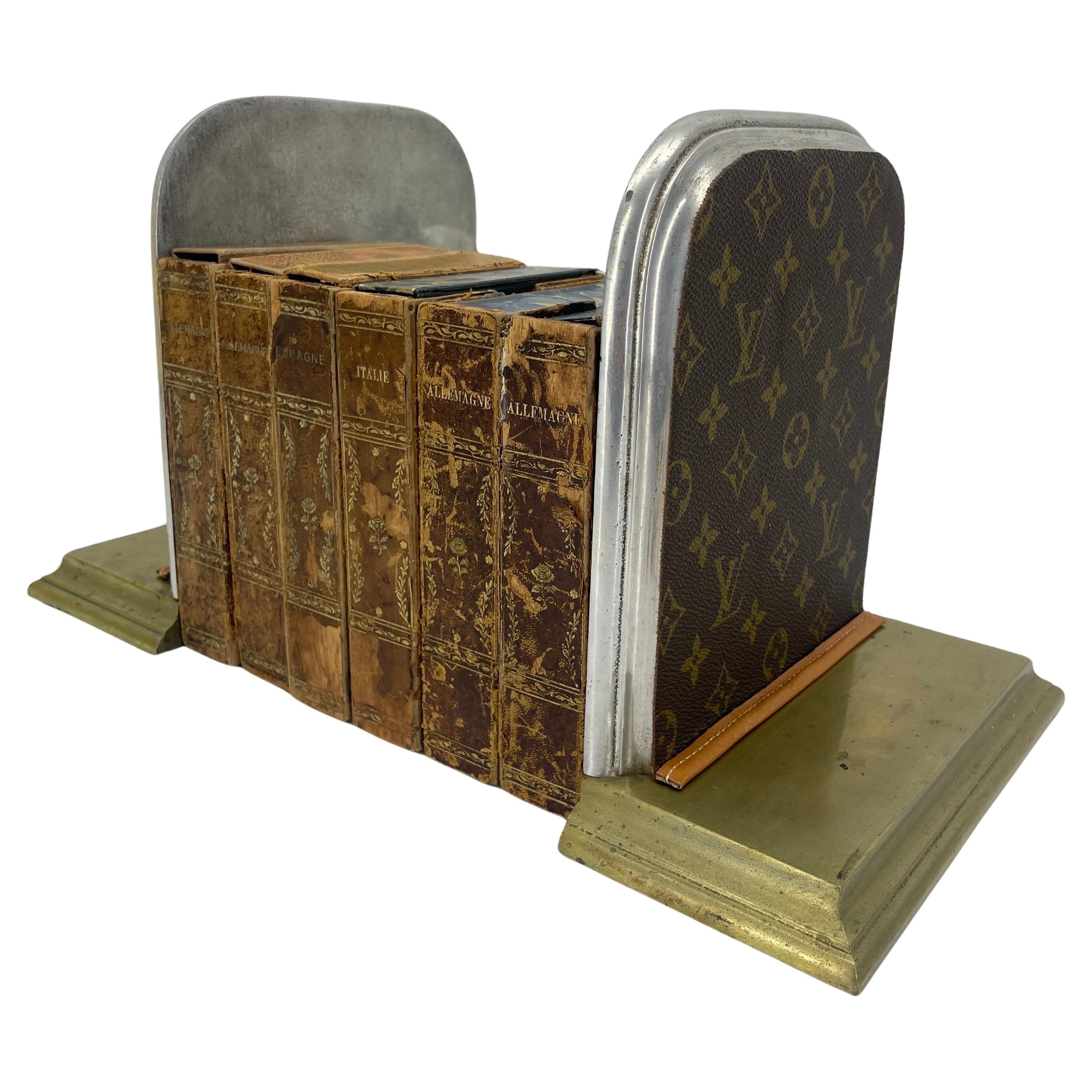 Mid-Century Pair of Brass and Chrome Bookends with Louis Vuitton Monogram Fabric

These custom, very substantial monogrammed bookends are hand crafted with authentic LV fabric and accentuated with authentic LV vachetta leather. This classic pair are