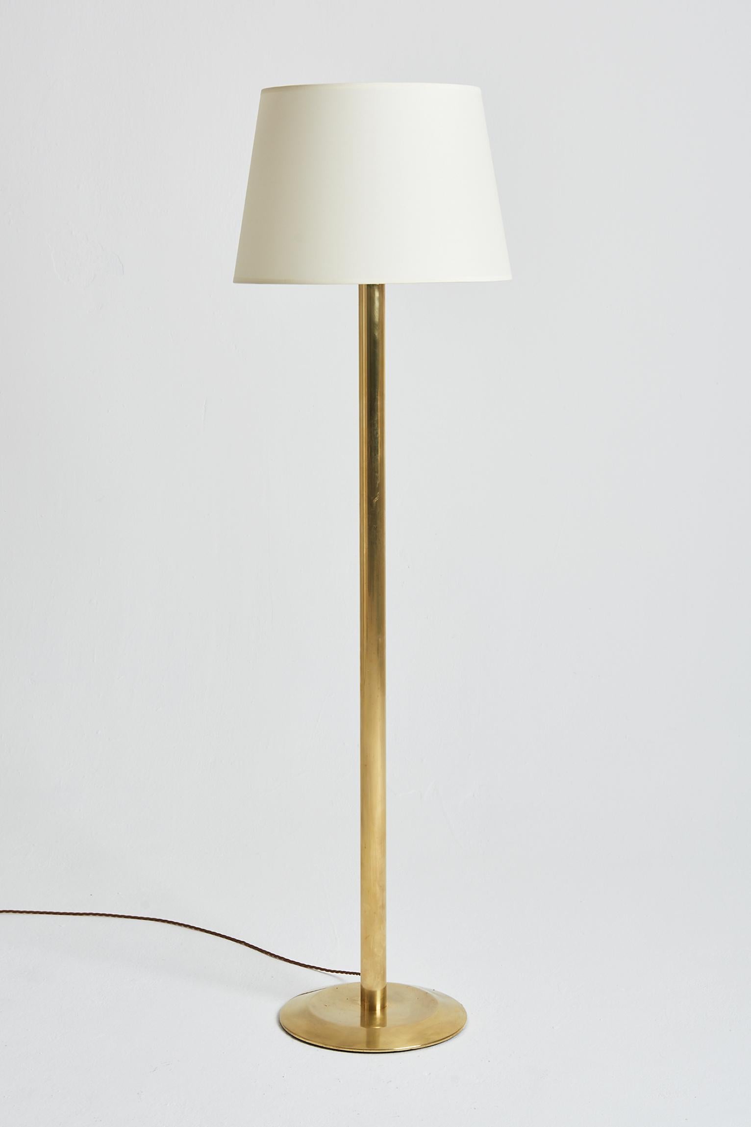 A pair of brass floor lamps.
Sweden, third quarter of the 20th century.
With the shade: 159 cm high by 45 cm diameter.
Lamp bases only: 133 cm high by 32 cm diameter.