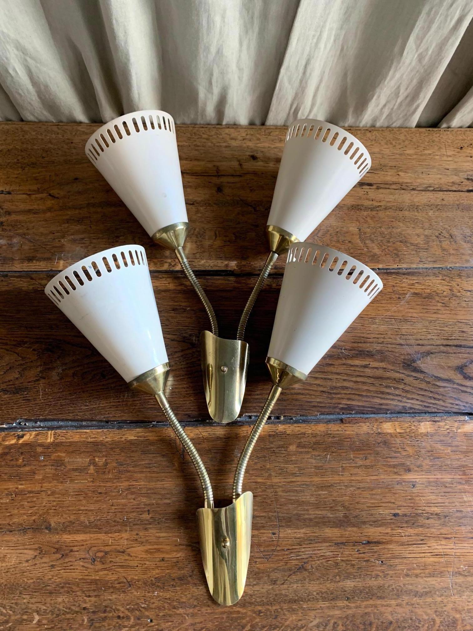 Pair of flexible metal wall sconces, each with two shades in paint enameled metal, flexible arms brass.