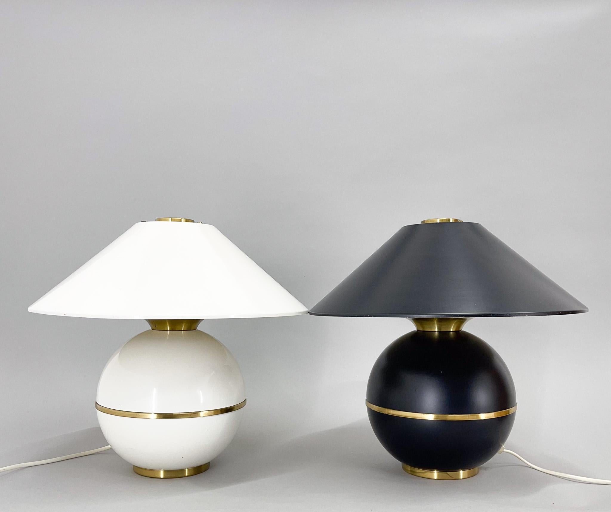 Set of two black and white metal table lamps with brass details. Luxurios piece of vintage lighting. Produced by famous Napako in former Czechoslovakia in the 1970s. 
Bulbs: 2x 1 x E26-E27. Rewired.
US plug adapter included.