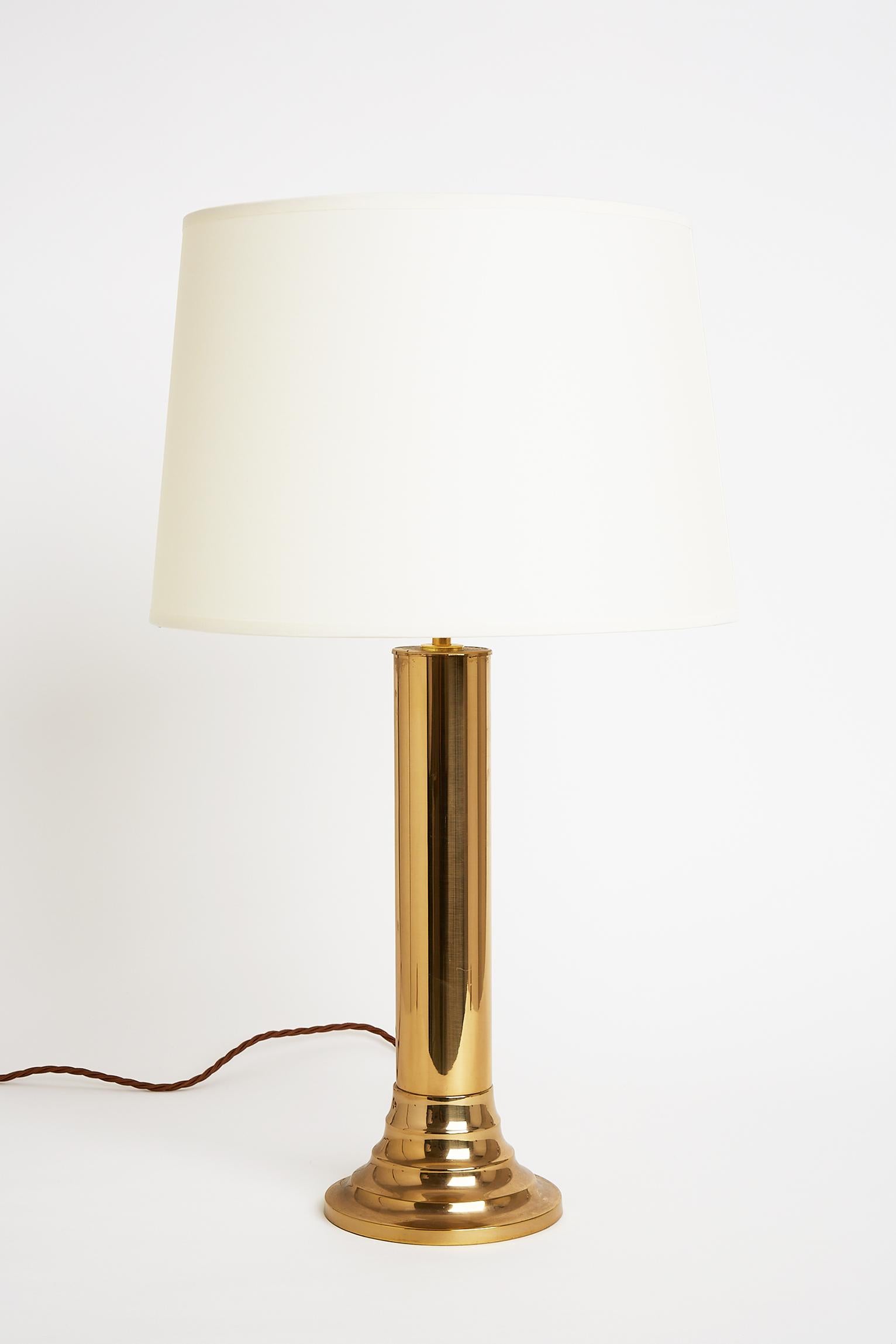 A pair of brass table lamps by Bergboms.
Bearing the maker's label.
Sweden, circa 1970.
With the shade: 63 cm tall by 36 cm diameter
Lamp base only: 42 cm tall by 14.5 cm diameter.
  