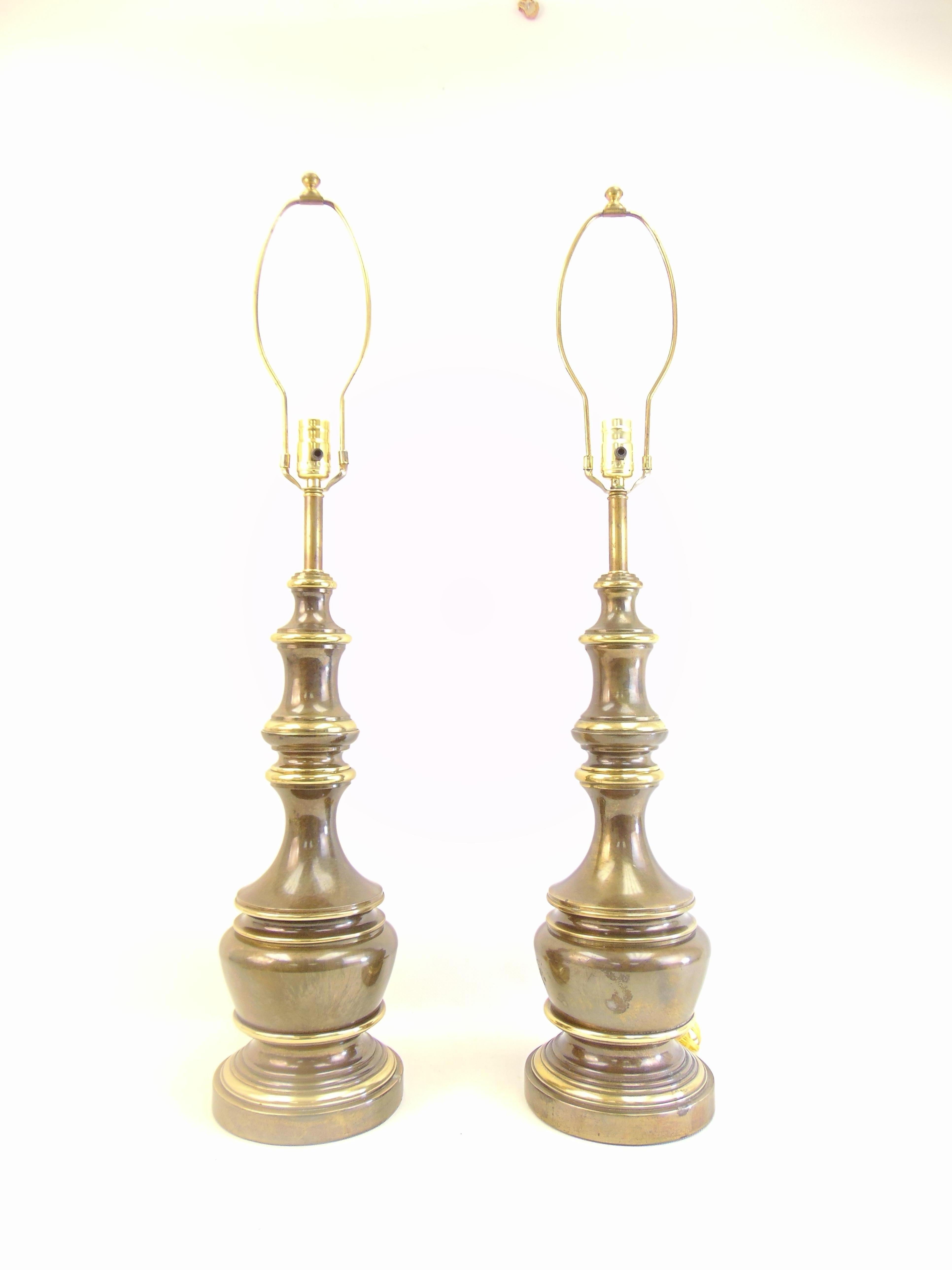 Beautiful vintage pair of brass table lamps from the 1970s. These have a great patina to them and show the perfect amount of age and years.