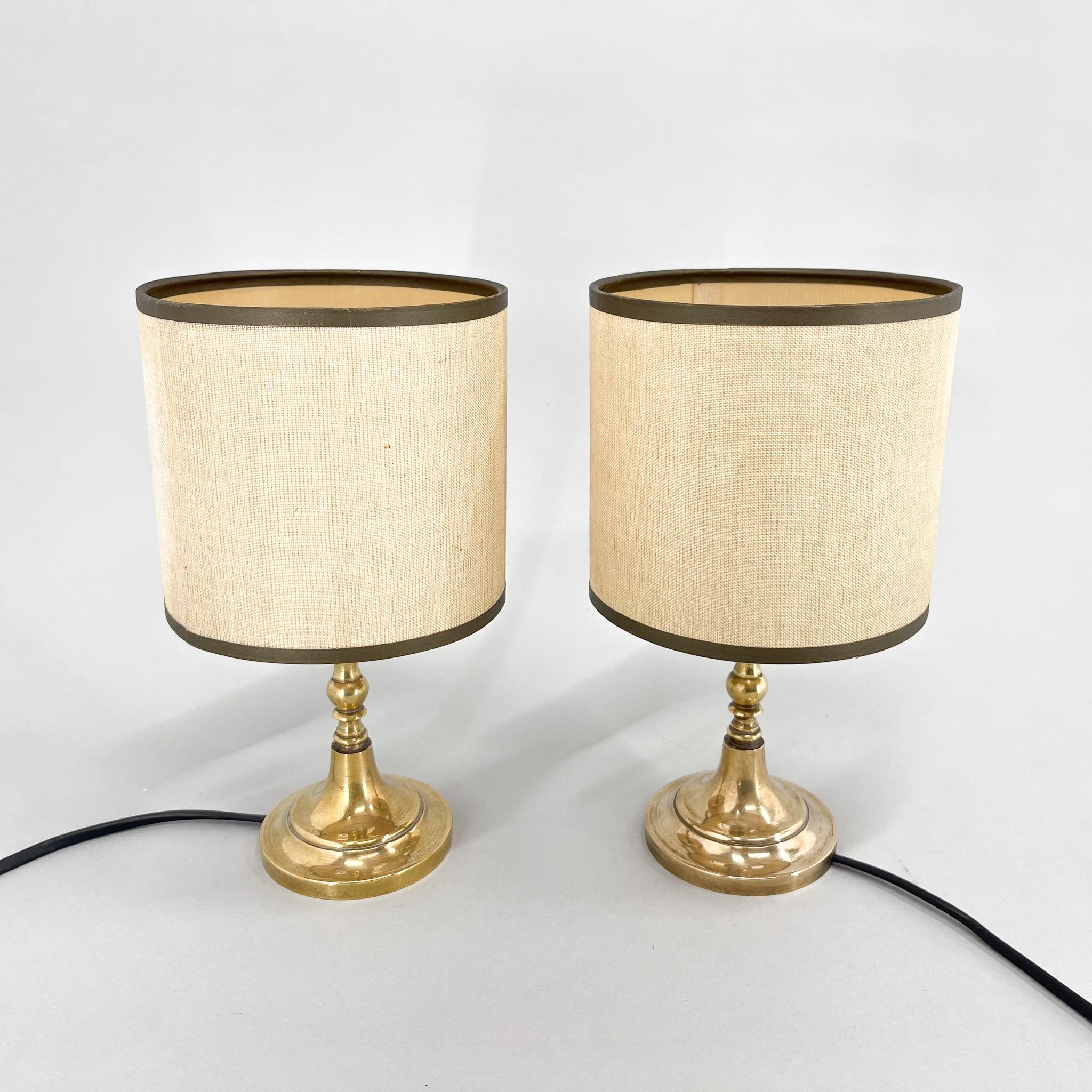Set of two vintage table or bedside lamps from Italy. Brass base and original fabric lamp shade. Rewired. Bulb: 2x 1  E14. US plug adapter included.