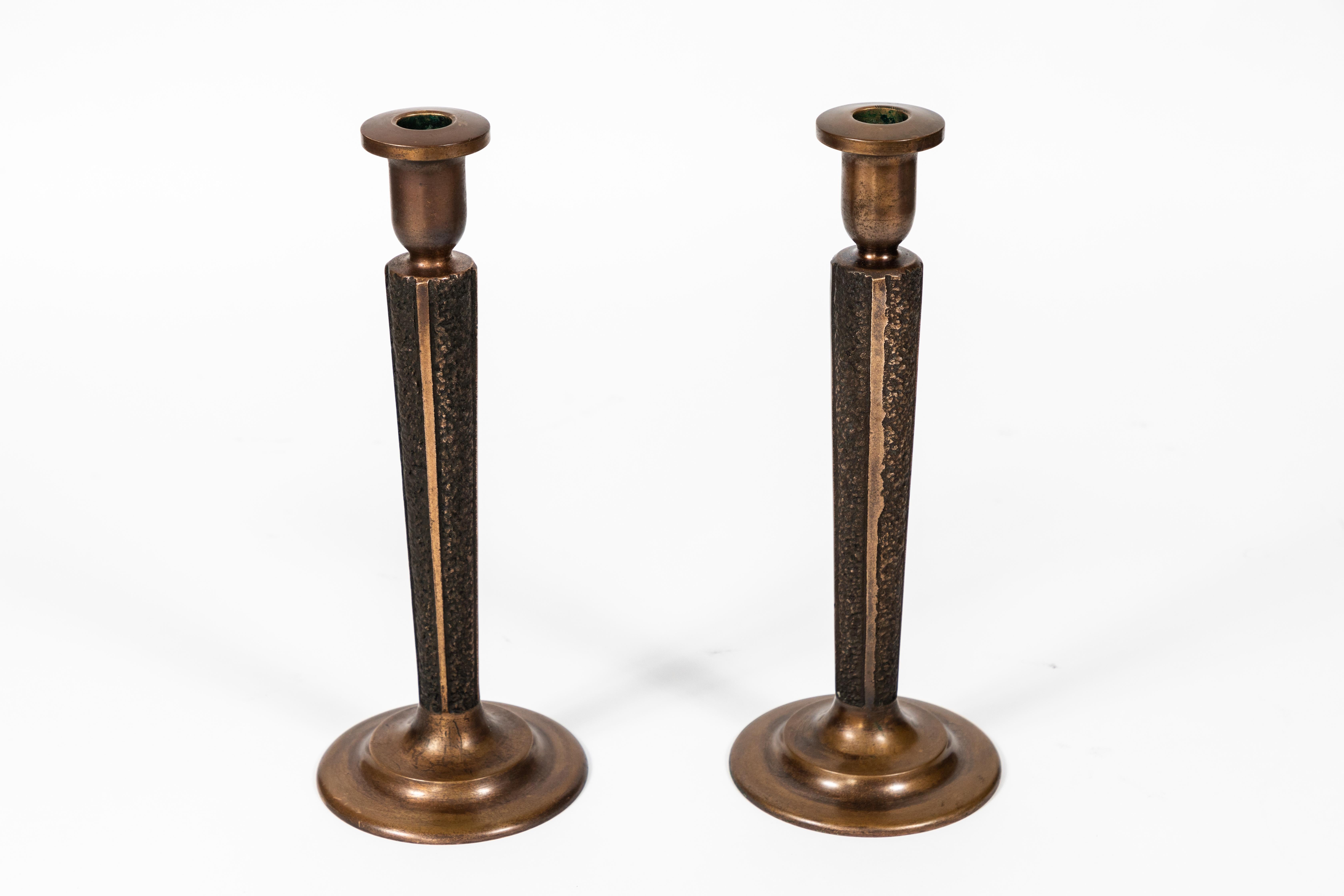 Pair of midcentury bronze 'Brutalist' candlesticks.